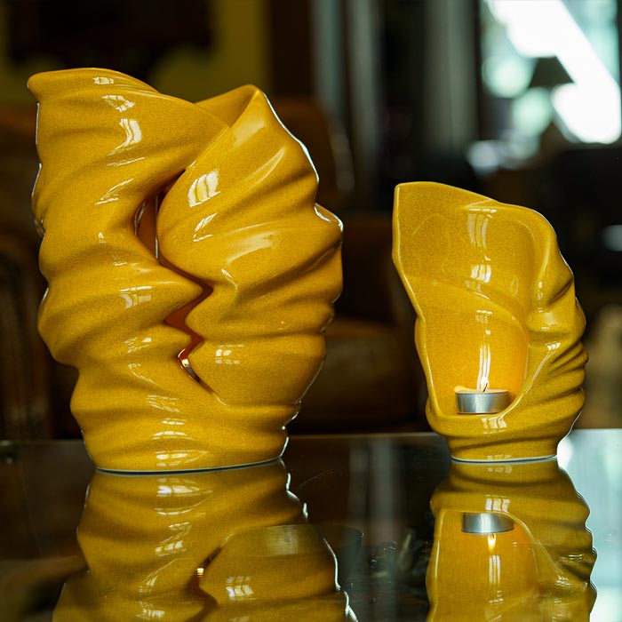 Light Cremation Urn for Ashes Amber with Keepsake on Table