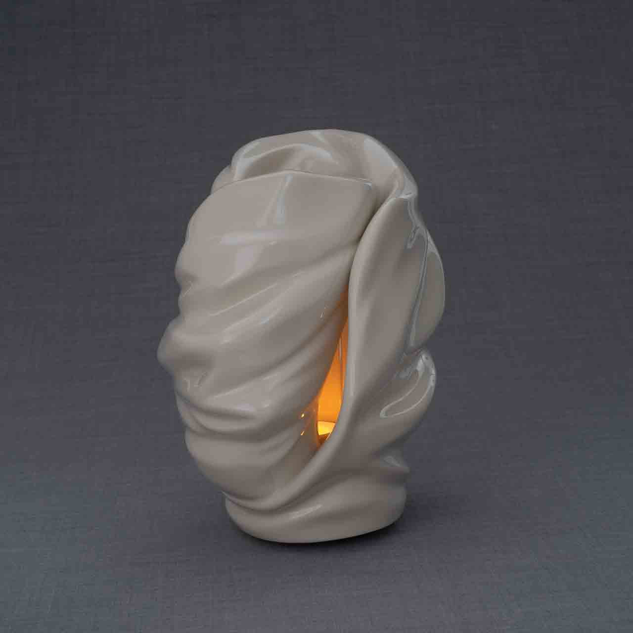 Light Cremation Urn for Ashes in Cream Turned To The Side Grey Background