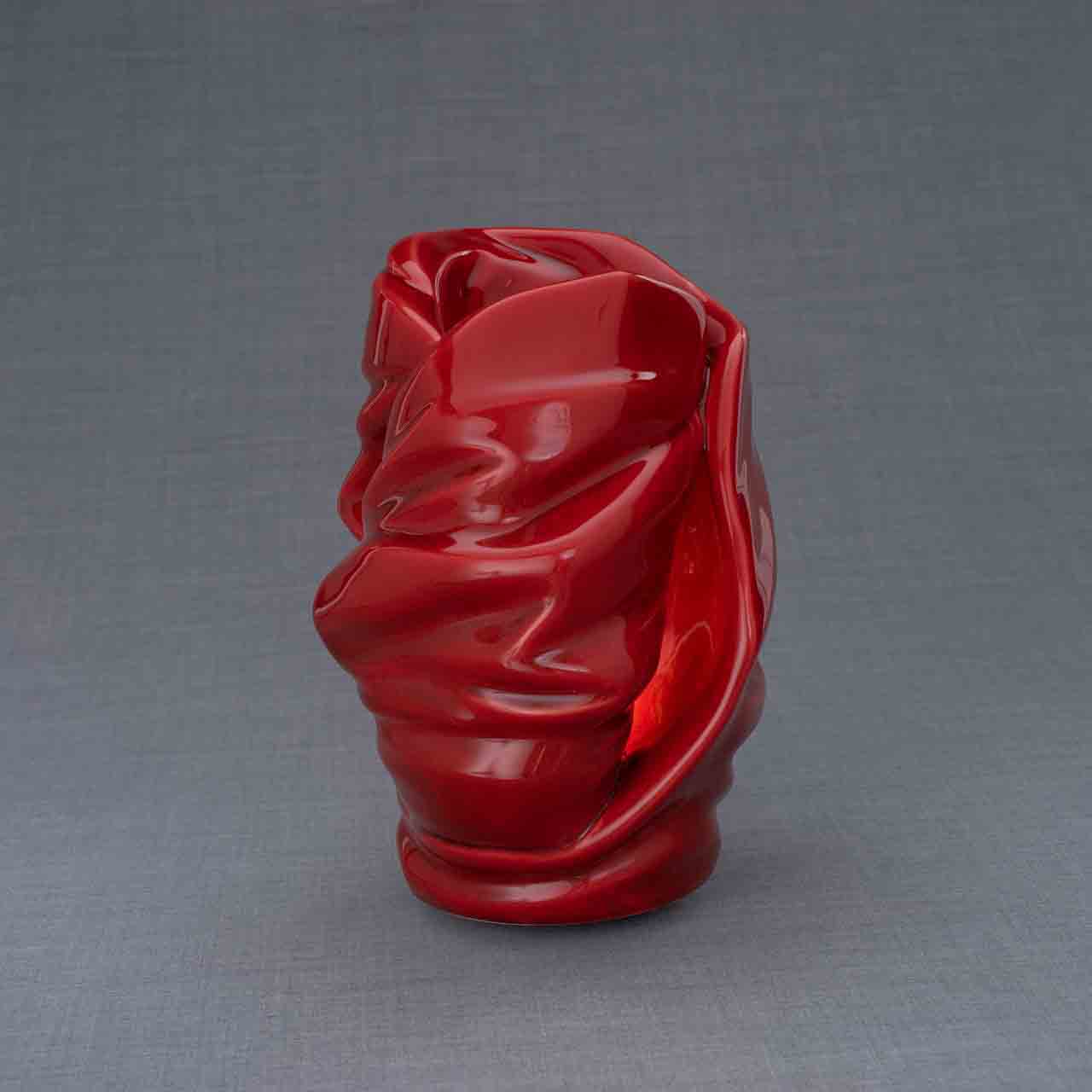 Light Cremation Urn for Ashes in Red Turned Around Grey Background