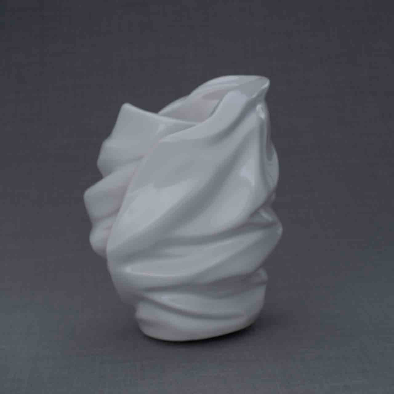 Light Cremation Urn for Ashes in White Behind Grey Background