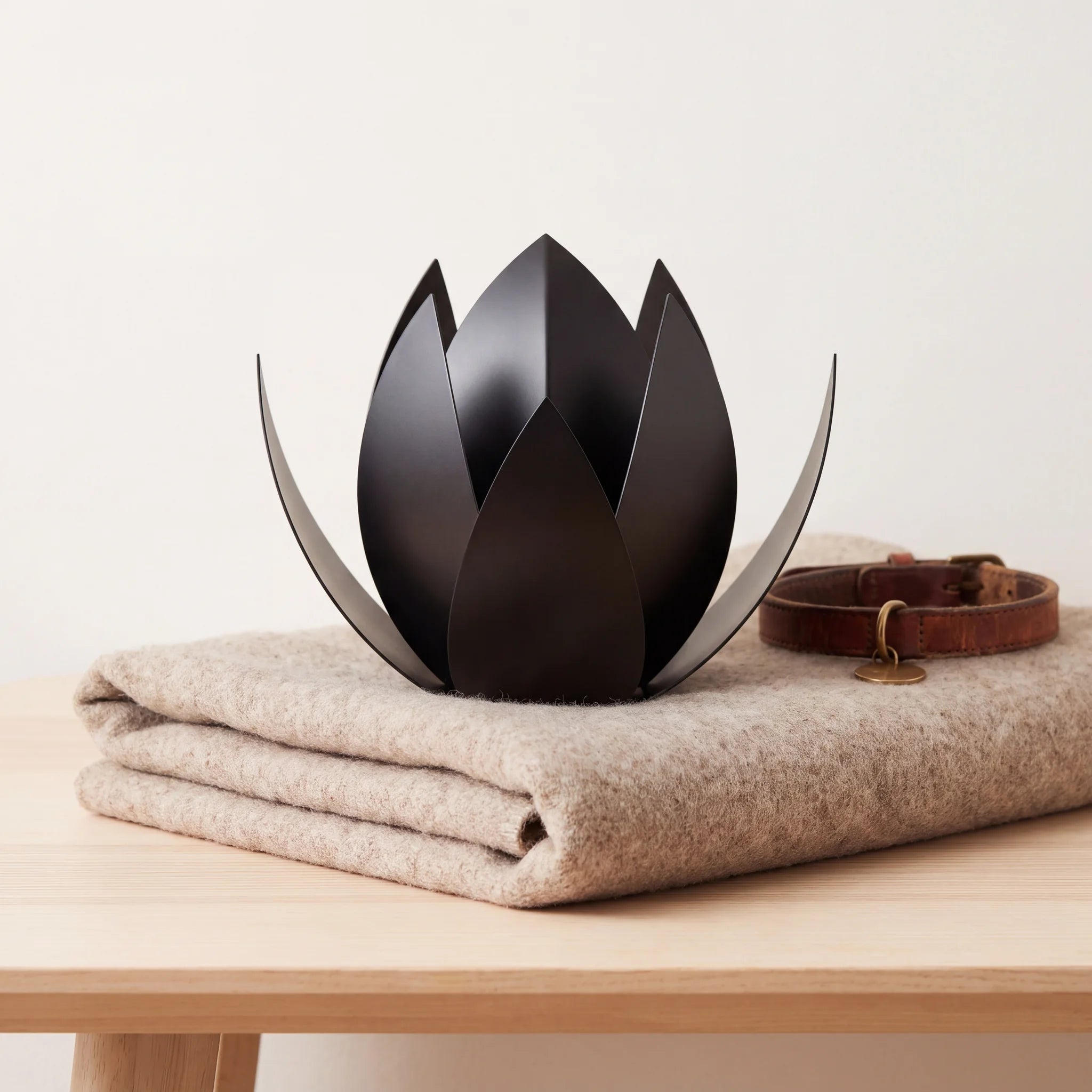 Lotus-Pet-Urn-for-Ashes-in-Matte-Black-Stainless-Steel-pet_blanket_fold
