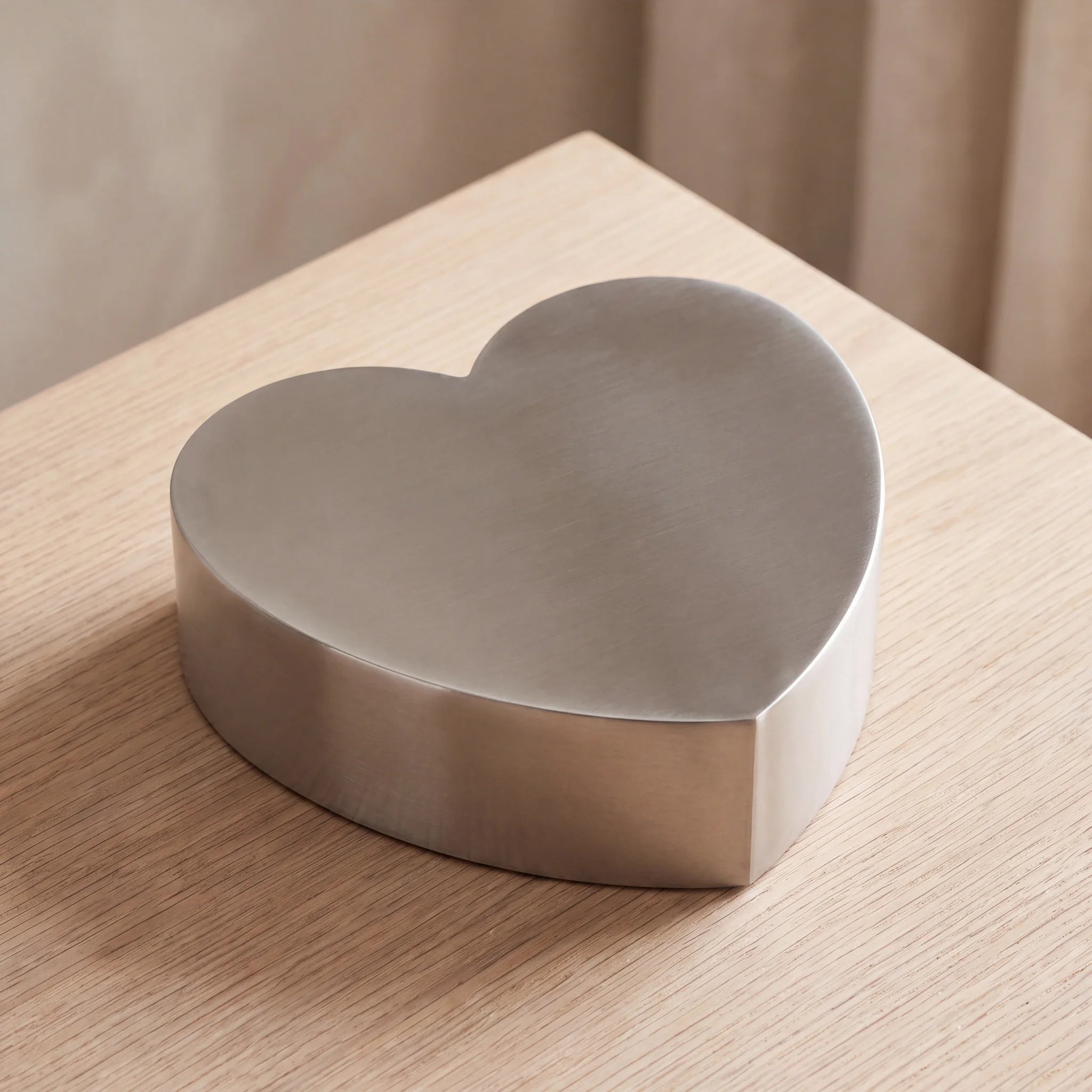 Love-Heart-Adult-Cremation-Urn-for-Ashes-in-Stainless-Steel-On-Oak