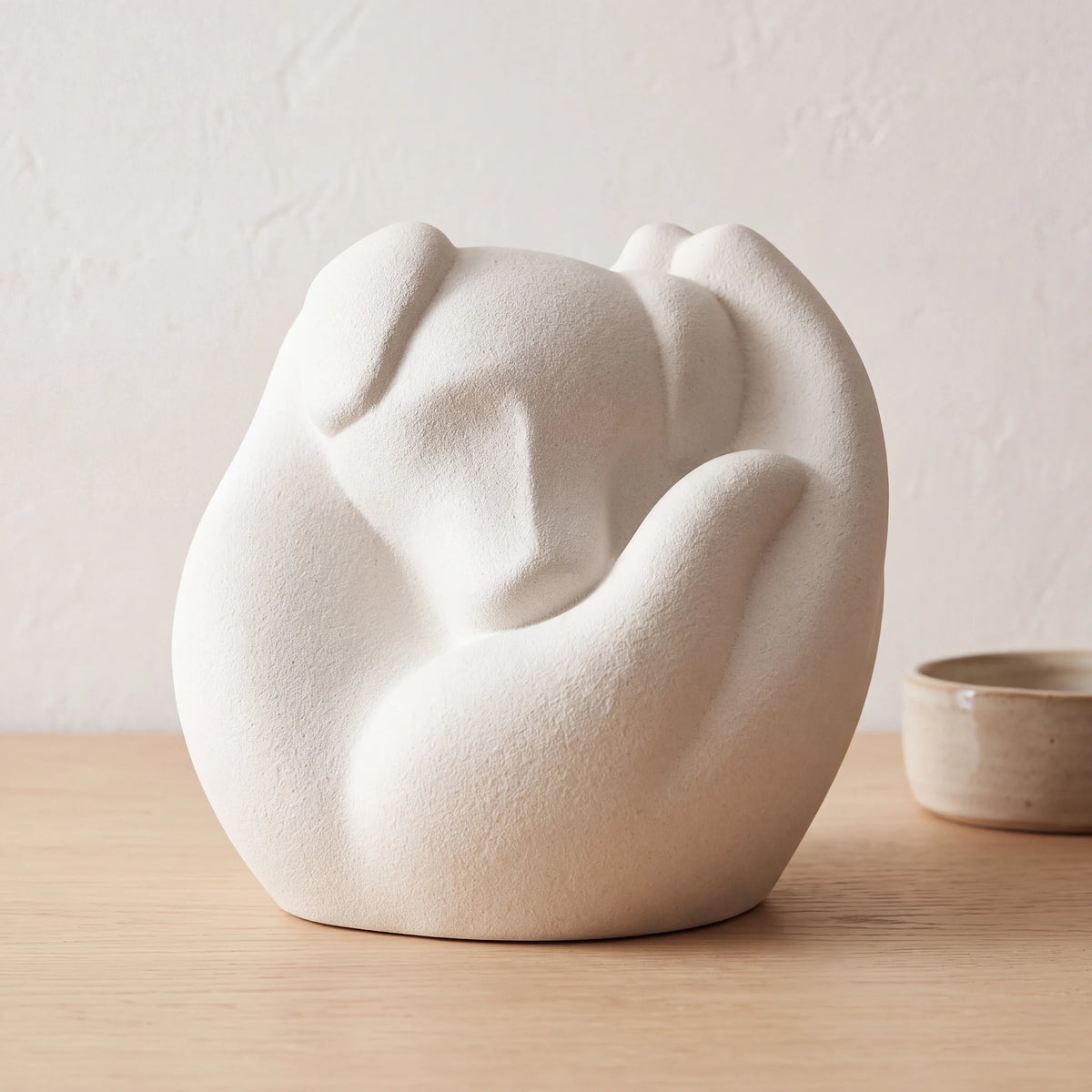 Loving-Hands-Dog-Pet-Urn-for-Ashes-in-White-pet_bowl_ledge