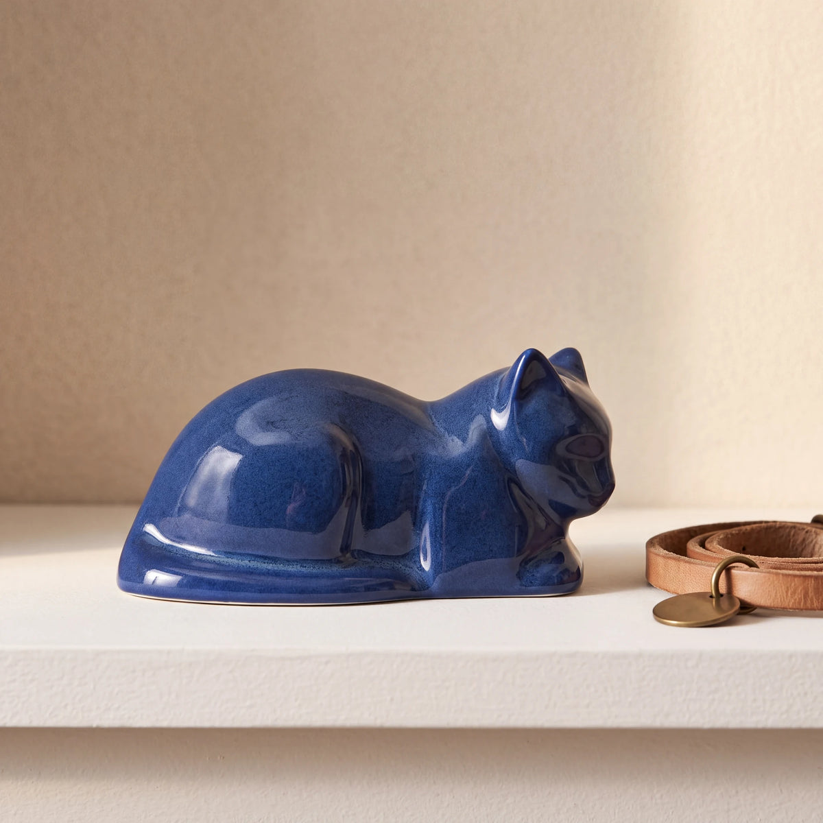 Lying-Cat-Mini-Urn-for-Ashes-in-Blue-pet_collar_ledge