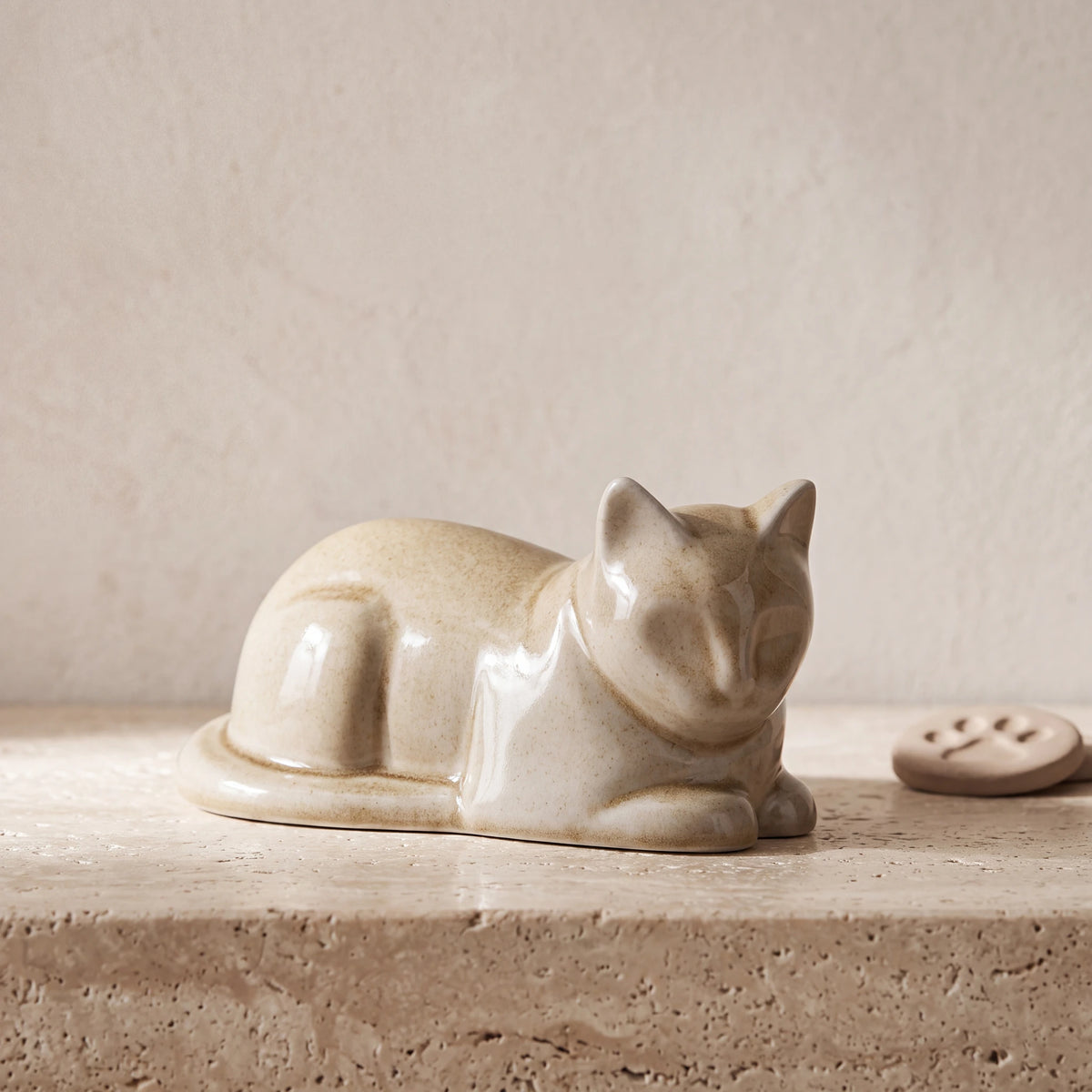 Lying-Cat-Mini-Urn-for-Ashes-in-Dark-Sand-pet_paw_token