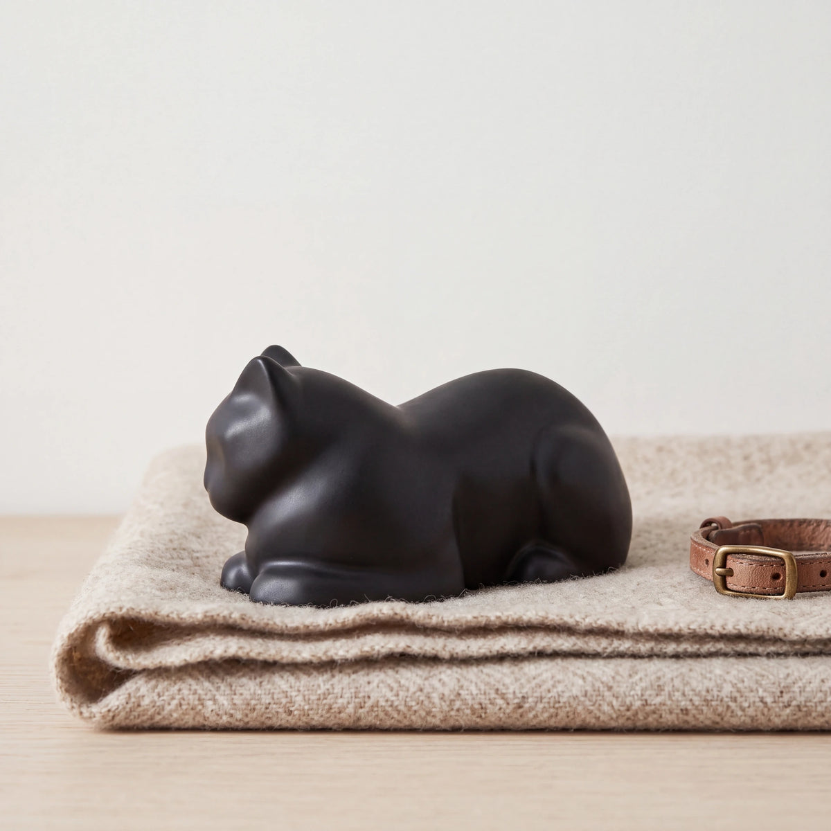 Lying-Cat-Mini-Urn-for-Ashes-in-Matte-Black-pet_blanket_fold