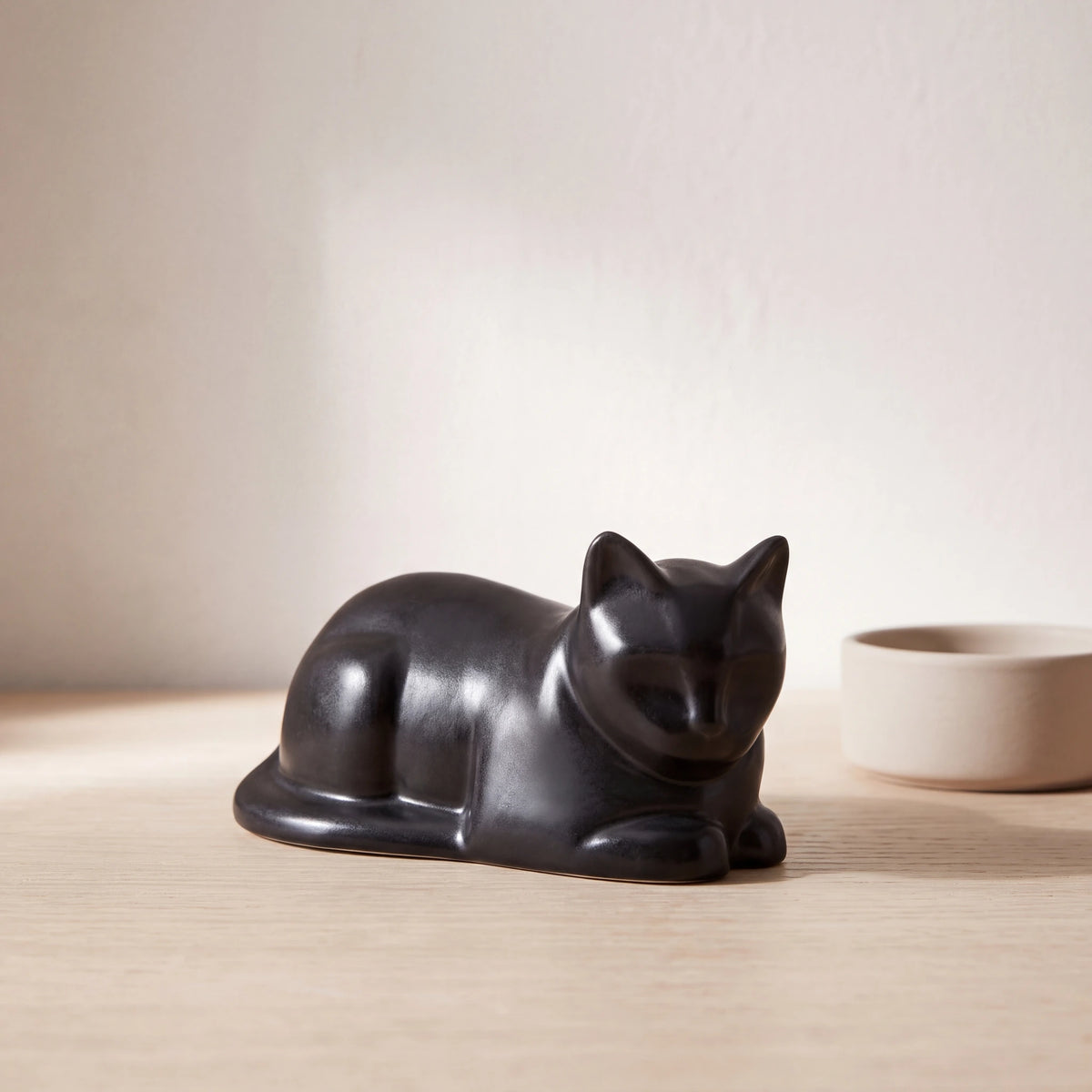 Lying-Cat-Mini-Urn-for-Ashes-in-Matte-Black-pet_bowl_ledge