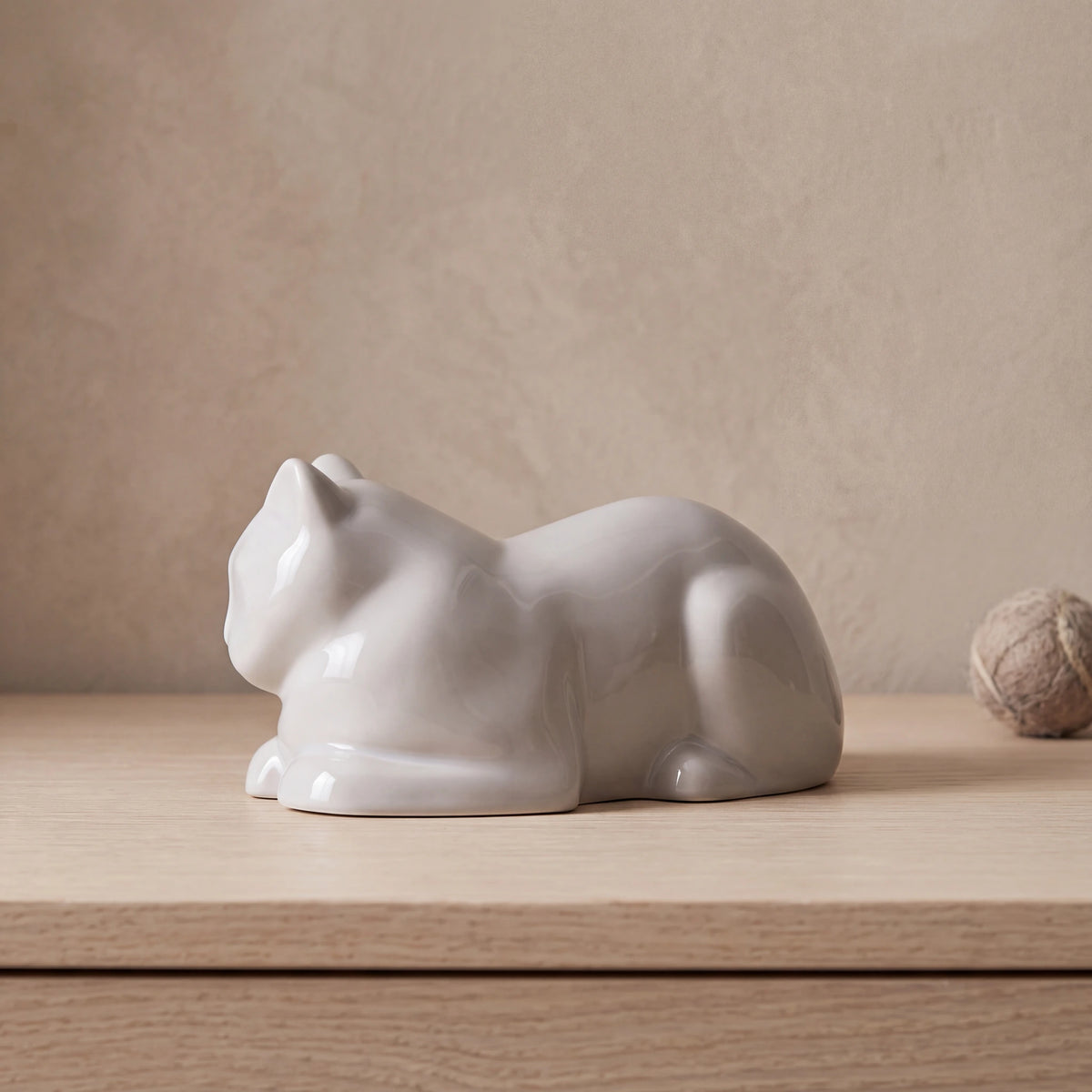 Lying-Cat-Mini-Urn-for-Ashes-in-White-pet_console_ball
