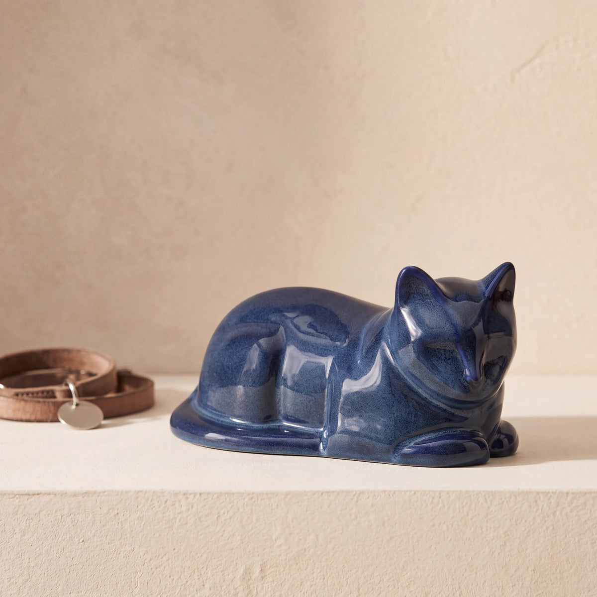 Lying-Cat-Urn-for-Ashes-in-Blue-pet_collar_ledge