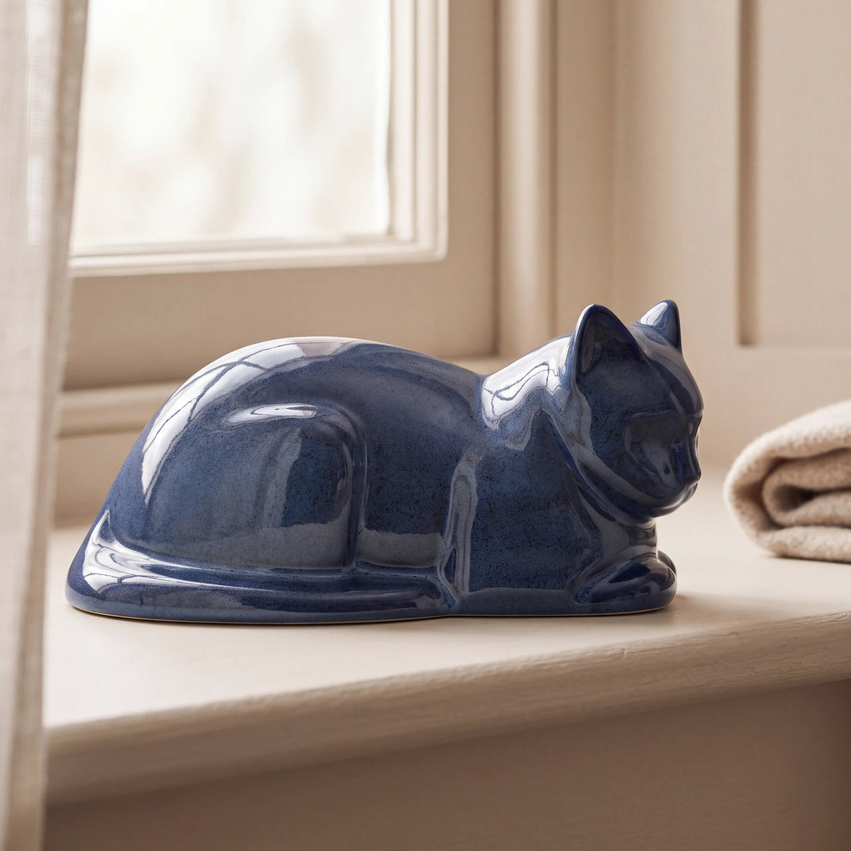 Lying-Cat-Urn-for-Ashes-in-Blue-pet_sunny_sill