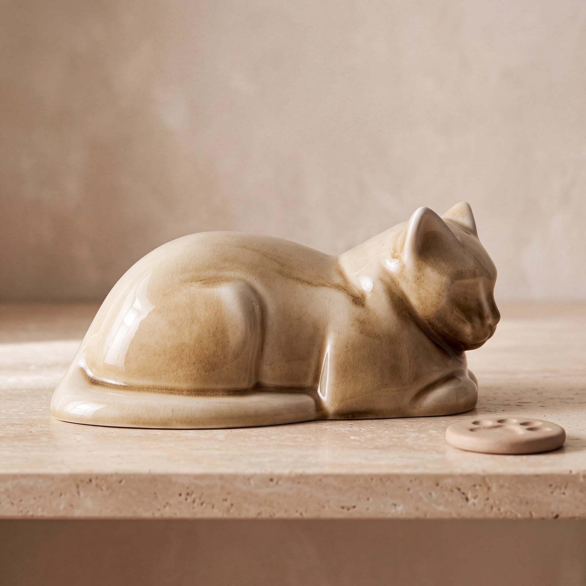Lying-Cat-Urn-for-Ashes-in-Dark-Sand-pet_paw_token