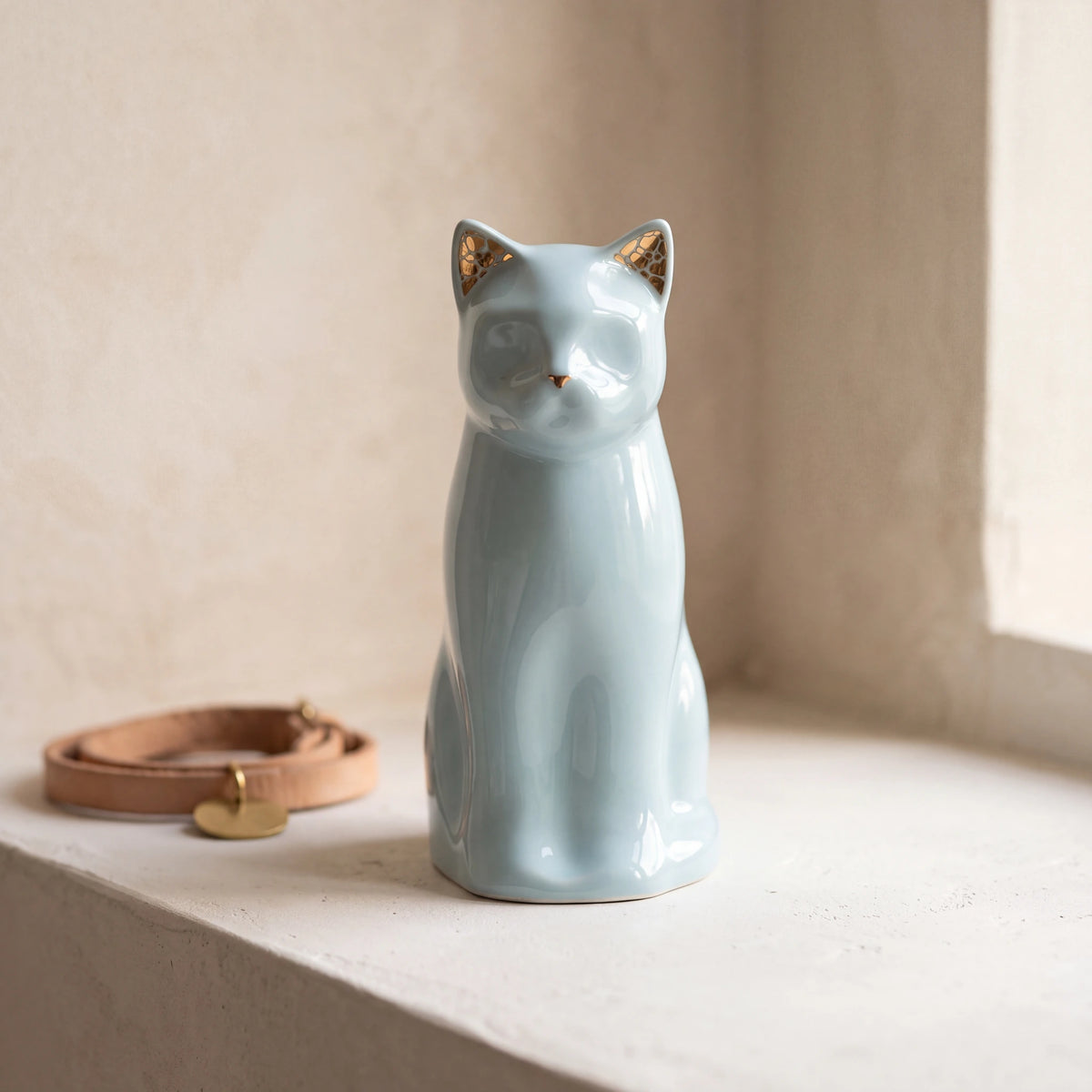 Meow-Cat-Pet-Urn-for-Ashes-in-Light-Blue-pet_collar_ledge
