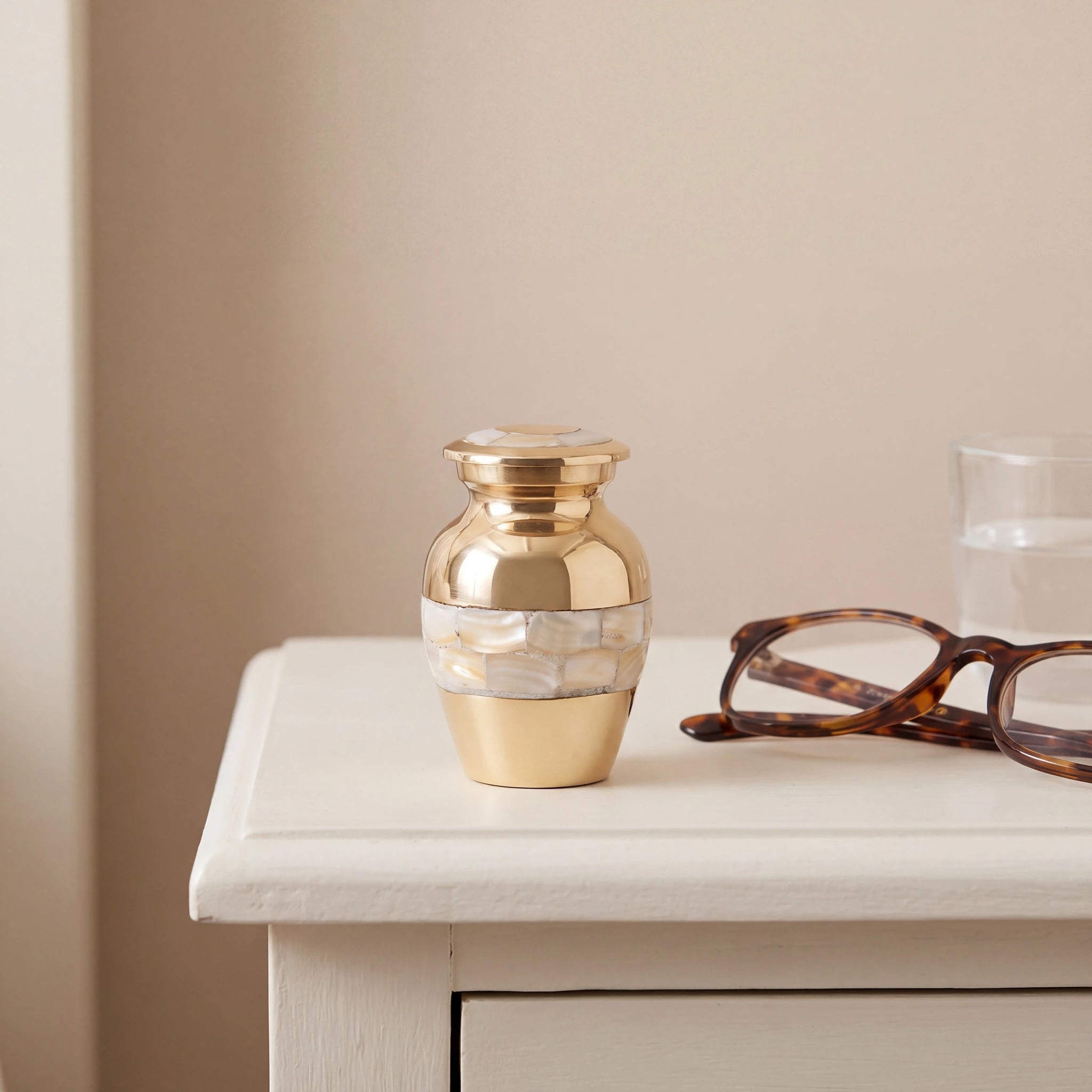 Mother-of-Pearl-Metal-Keepsake-Urn-for-Ashes-in-Gold-keepsake_bedside_glasses