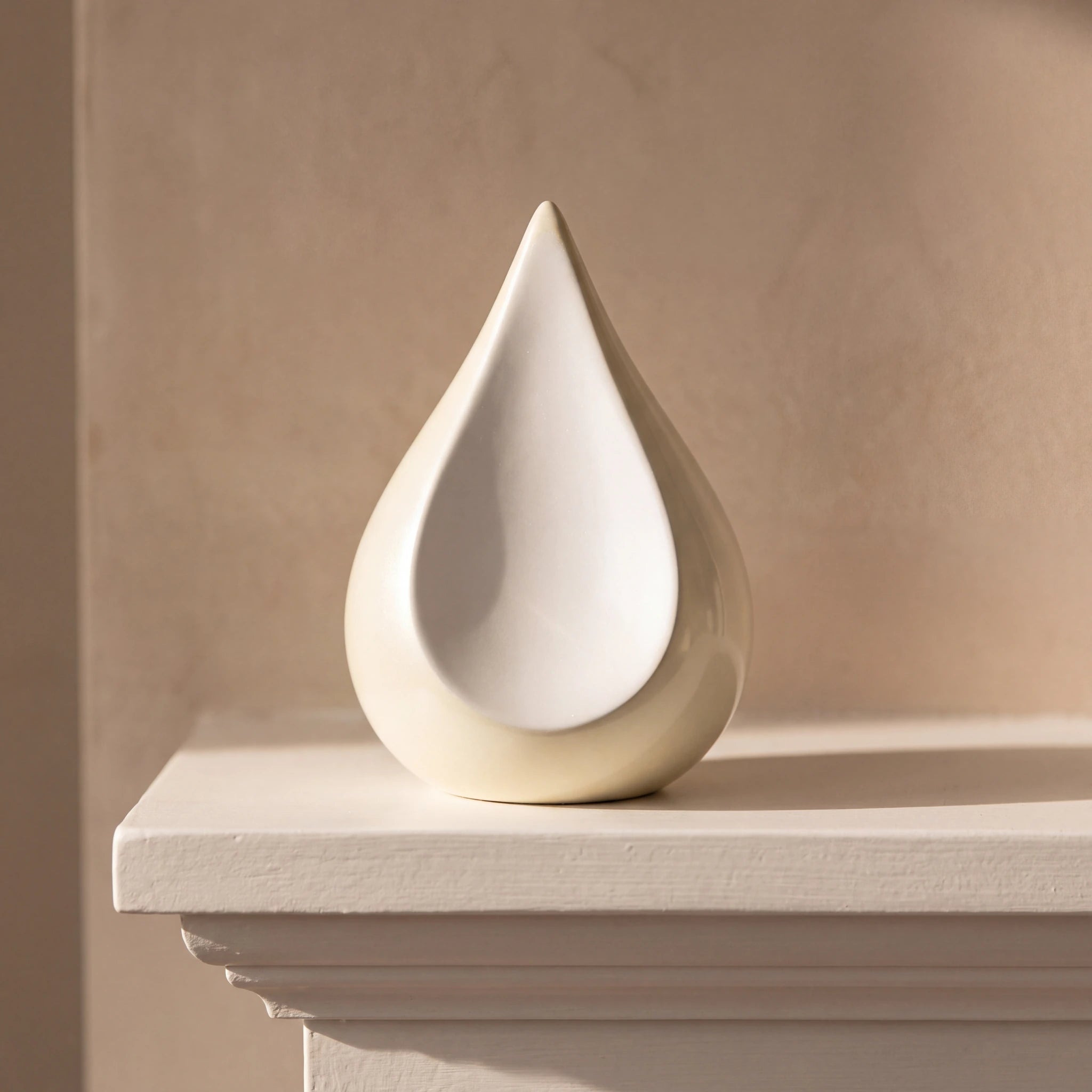 Odyssee-Metal-Teardrop-Keepsake-Urn-for-Ashes-in-Ivory-and-White-Mantelpiece