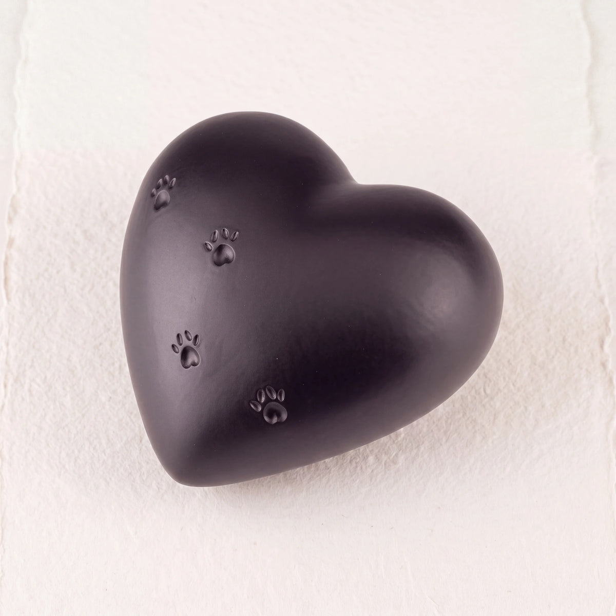 Paw-Print-Heart-Pet-Urn-for-Ashes-in-Black-heart_paper_above