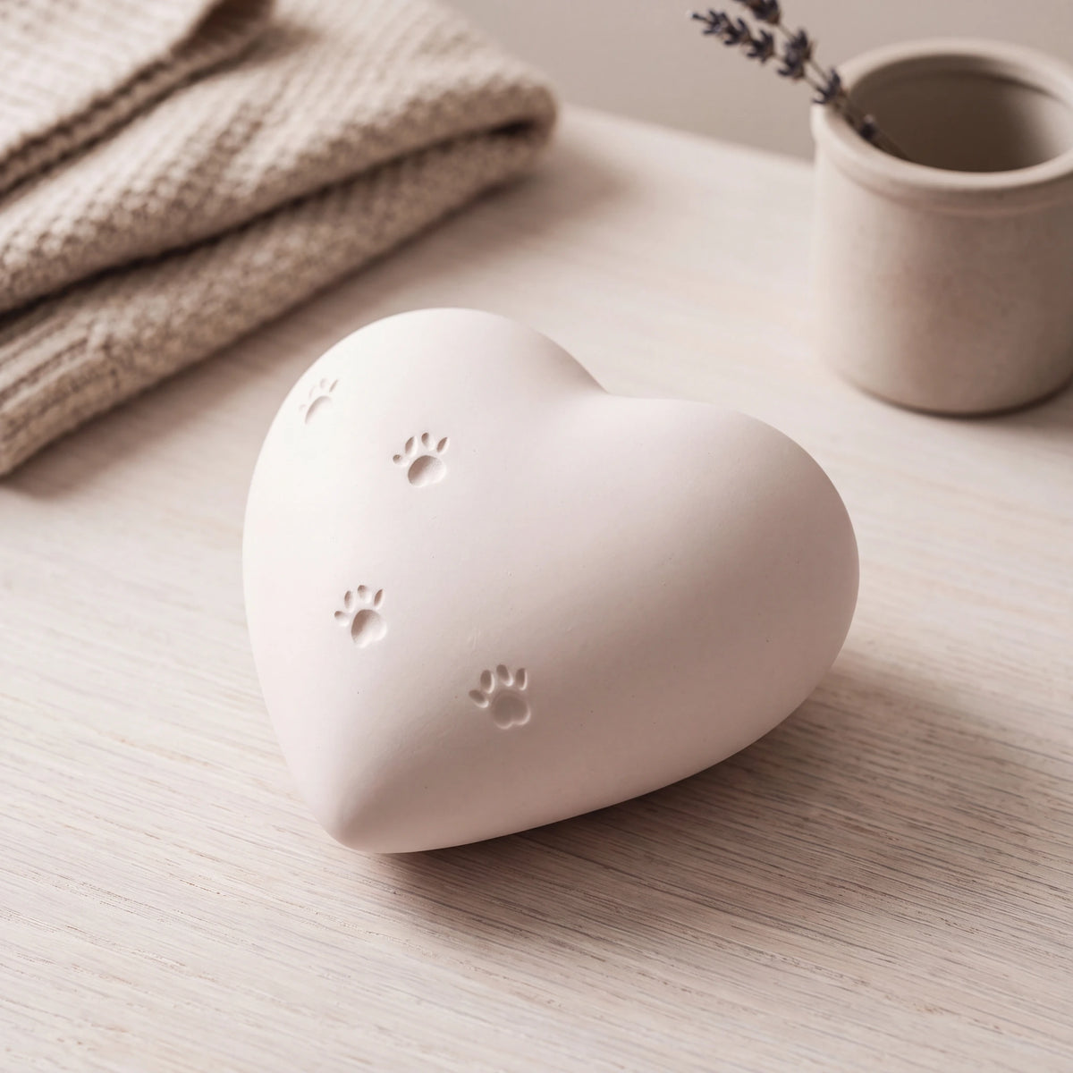 Paw-Print-Heart-Pet-Urn-for-Ashes-in-White-heart_limewash_above