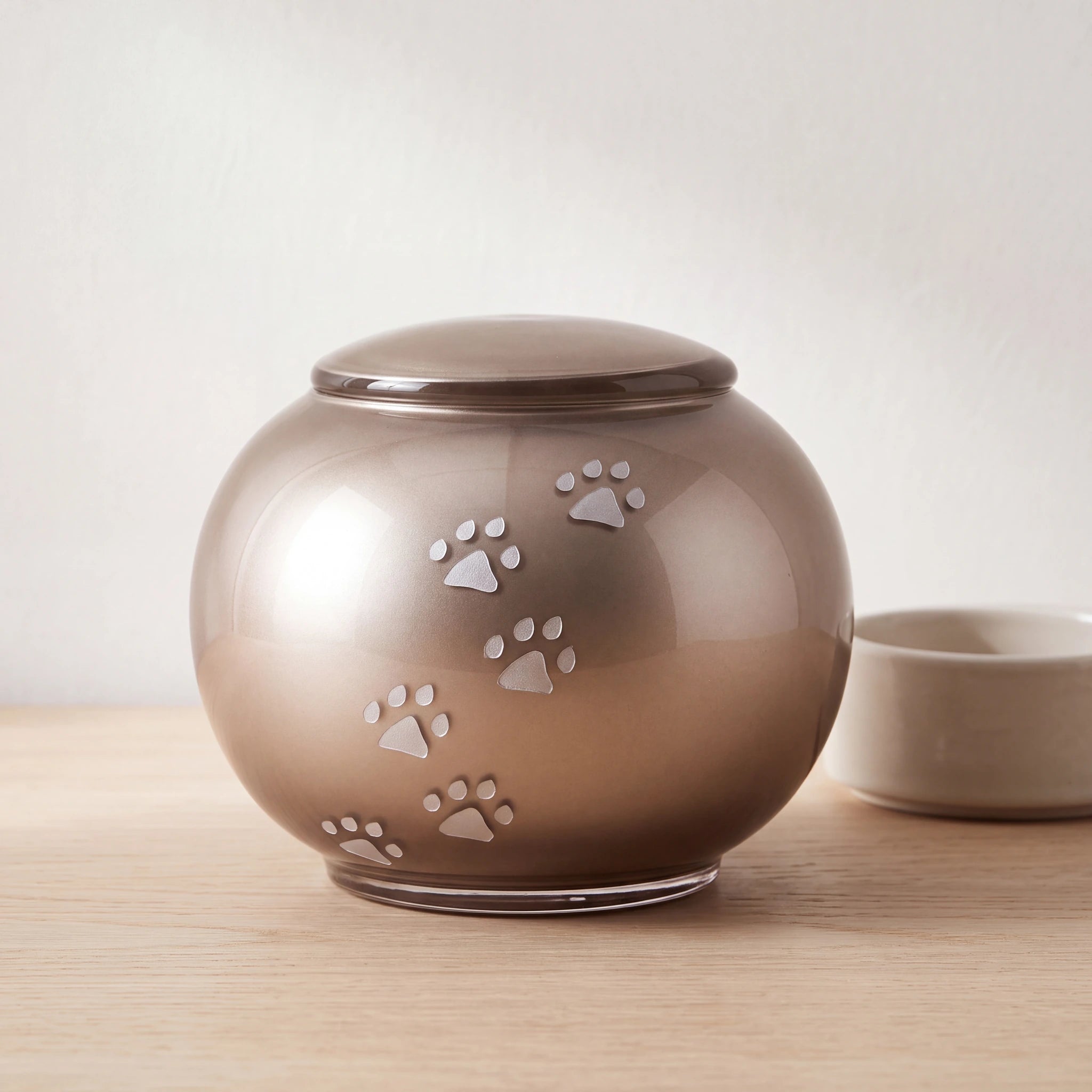 Pawprints-Round-Crystal-Pet-Urn-for-Ashes-in-Cappuccino-Large-pet_bowl_ledge