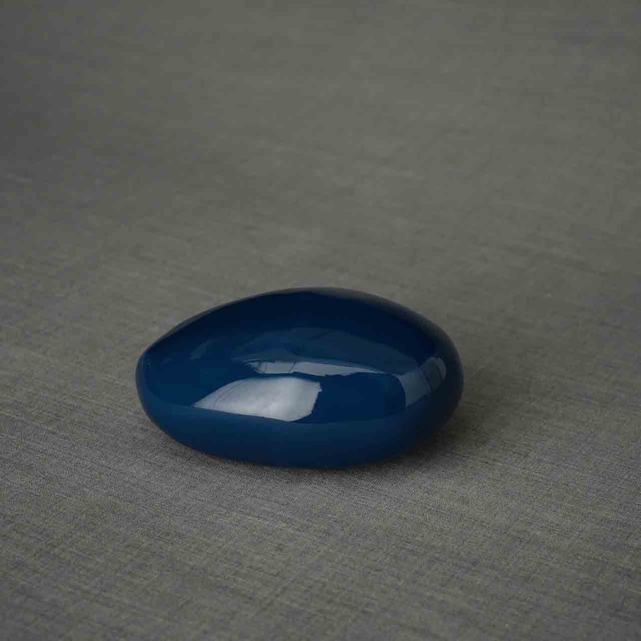Pebbles Ashes Keepsake Urn in Metallic Blue Dark Background