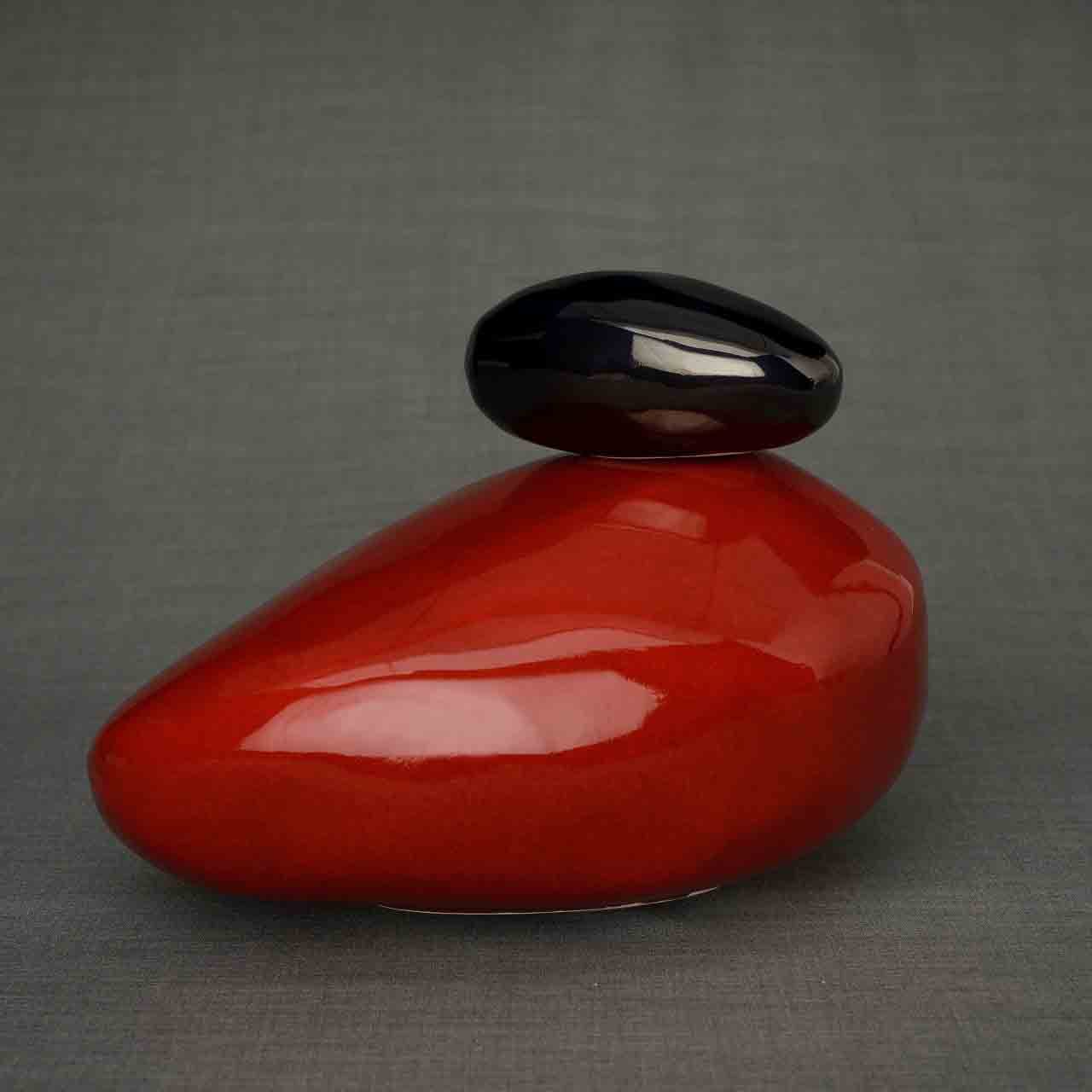 Pebbles Cremation Urn for Ashes in Red and Glossy Black Dark Background