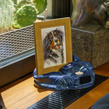 Picture Frame Pet Urns For Ashes In Blue Ceramic Facing Right With Photo Of Dog On Shelf