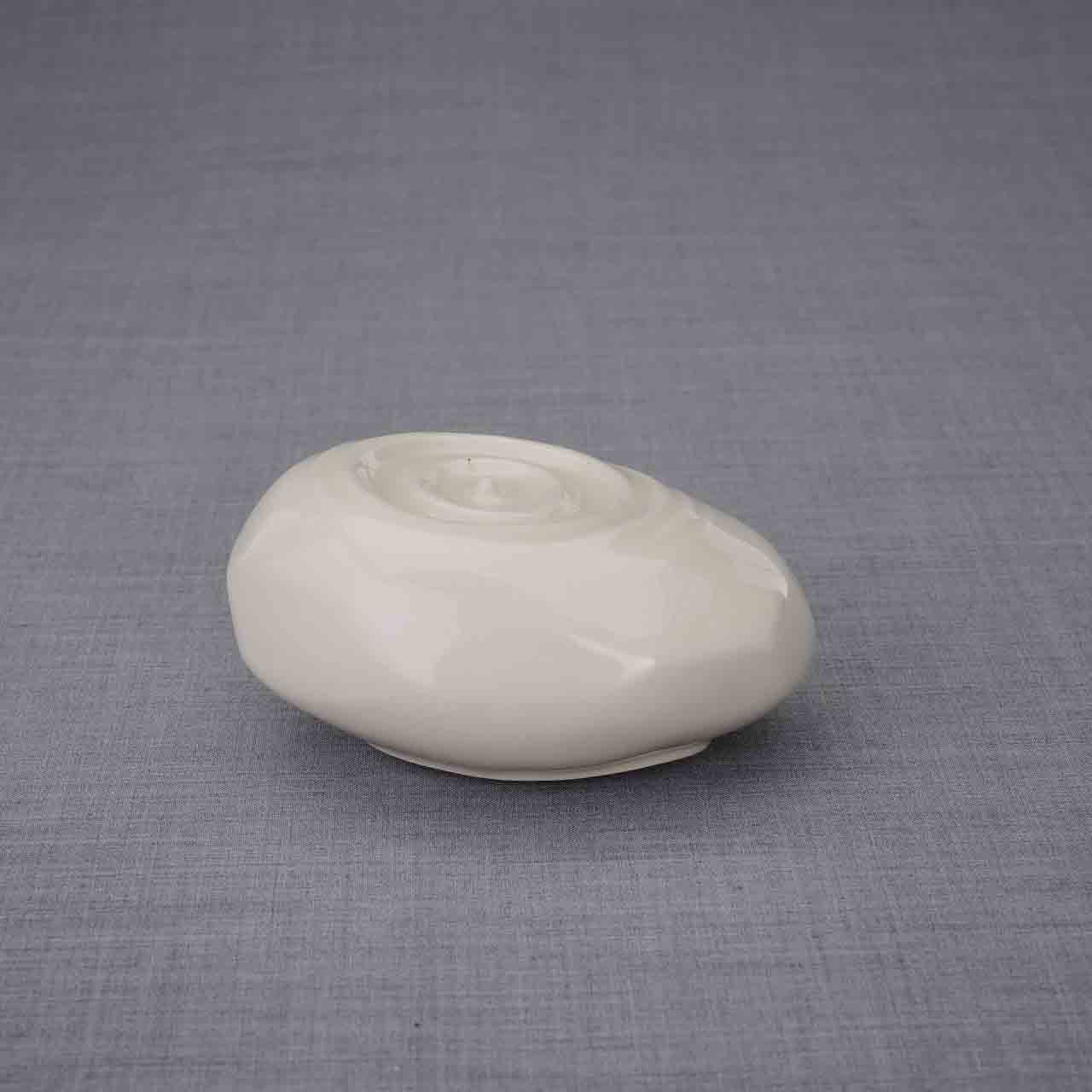 Resonance Ashes Keepsake Urn in Cream Facing Right Dark Background