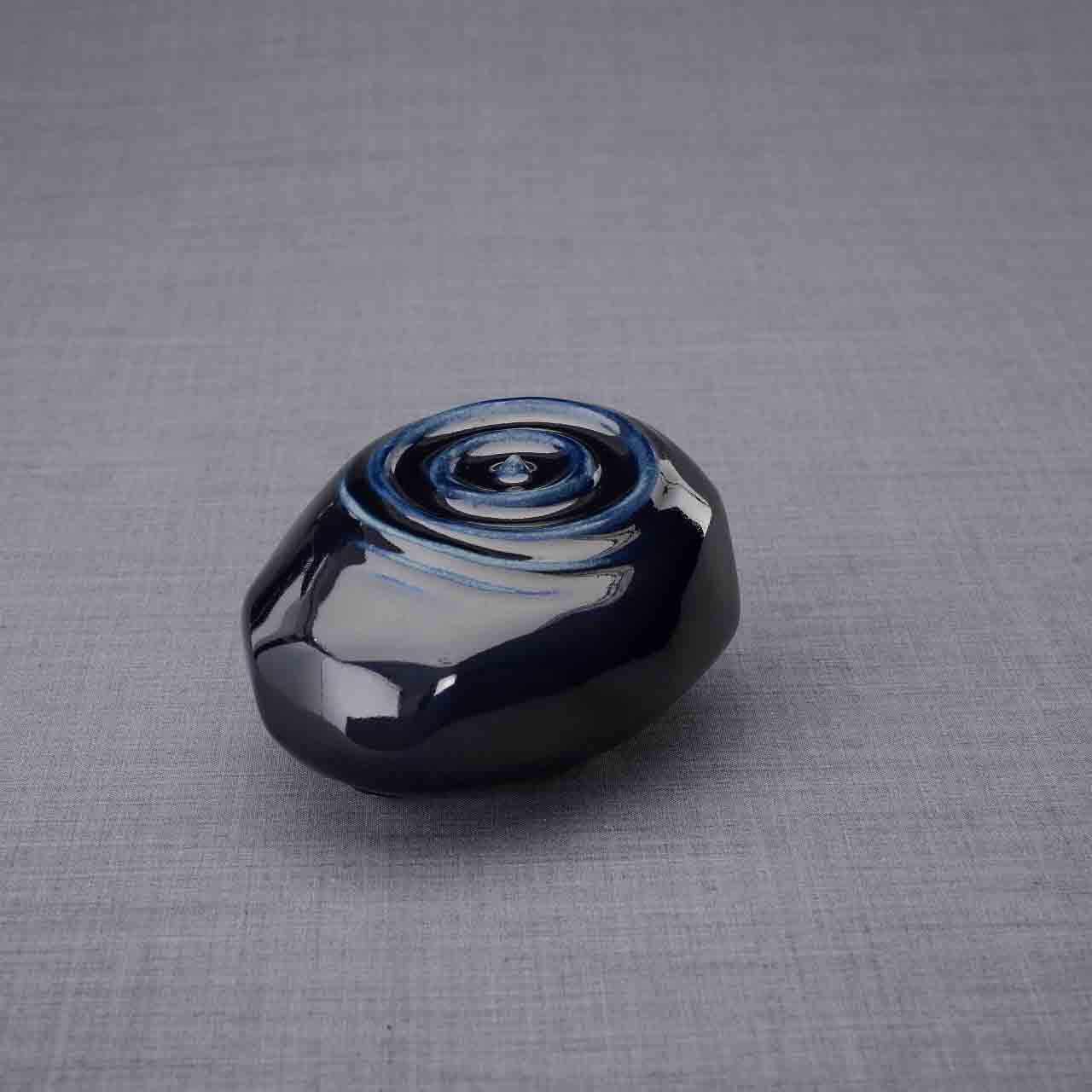 Resonance Ashes Keepsake Urn in Metallic Blue Turned Left Dark Background