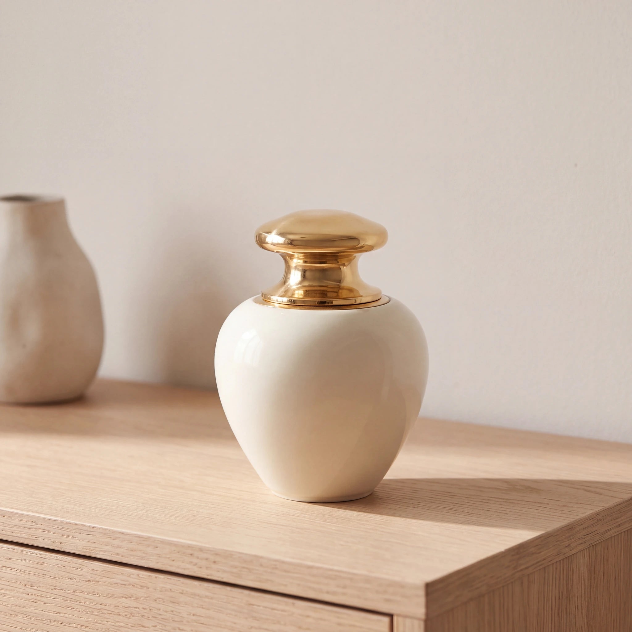 Satori-Metal-Keepsake-Urn-for-Ashes-in-Ivory-and-Gold-Oak-Console