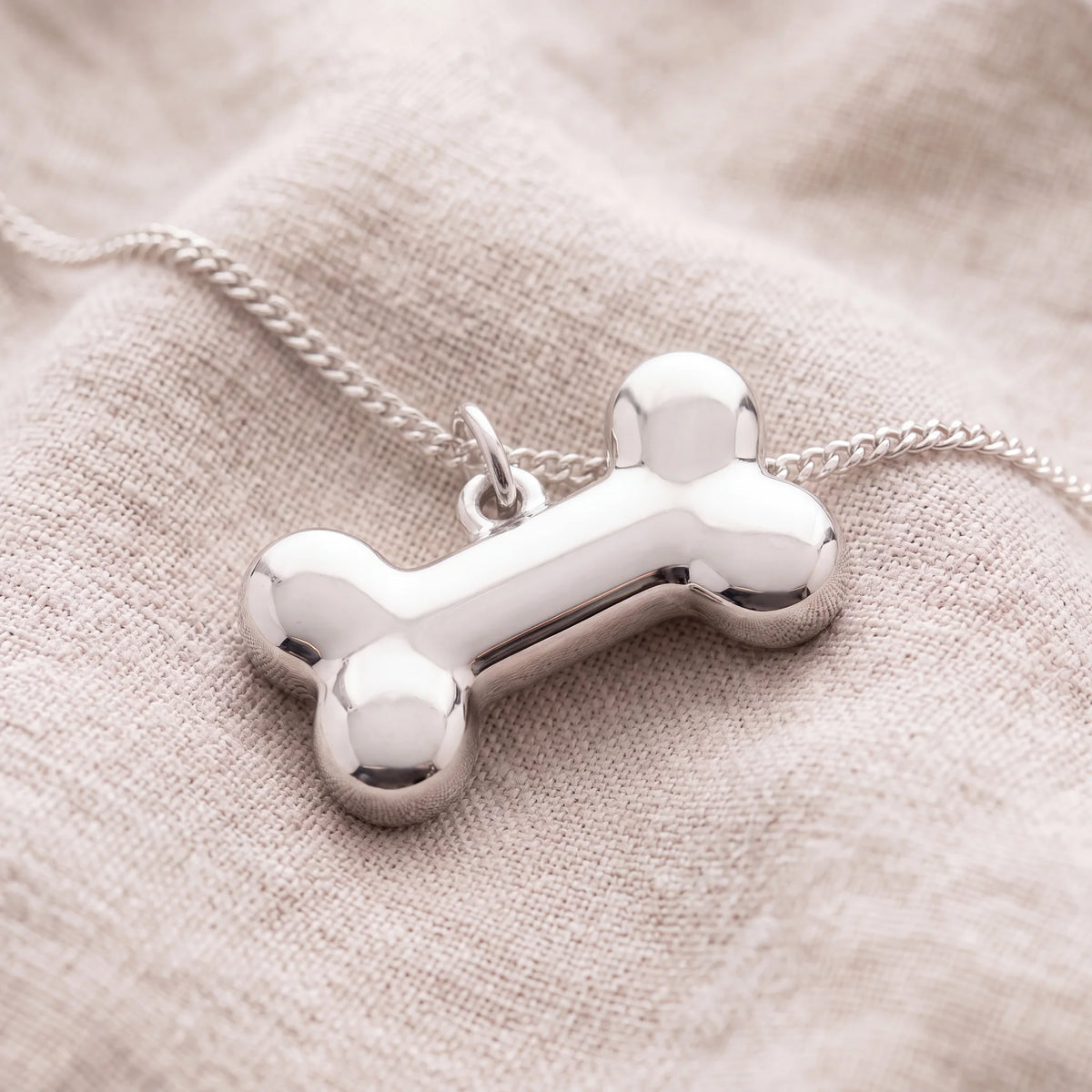 Self-fill-Dog-Bone-Memorial-Ashes-Pendant-On-Linen