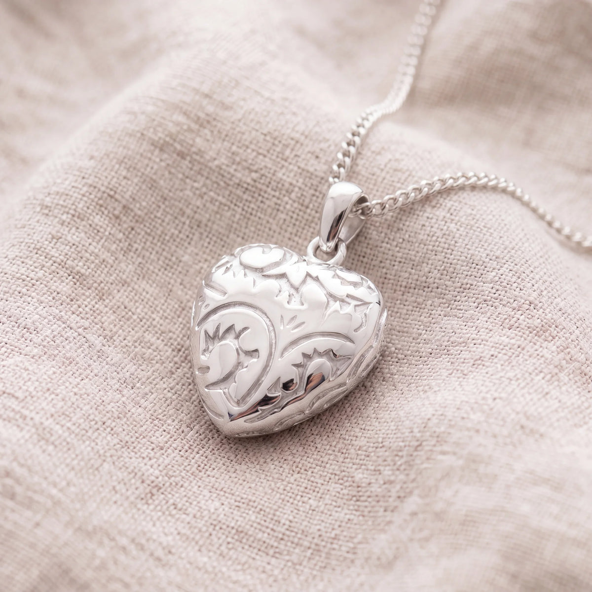 Self-fill-Flourish-Heart-Memorial-Ashes-Pendant-On-Linen