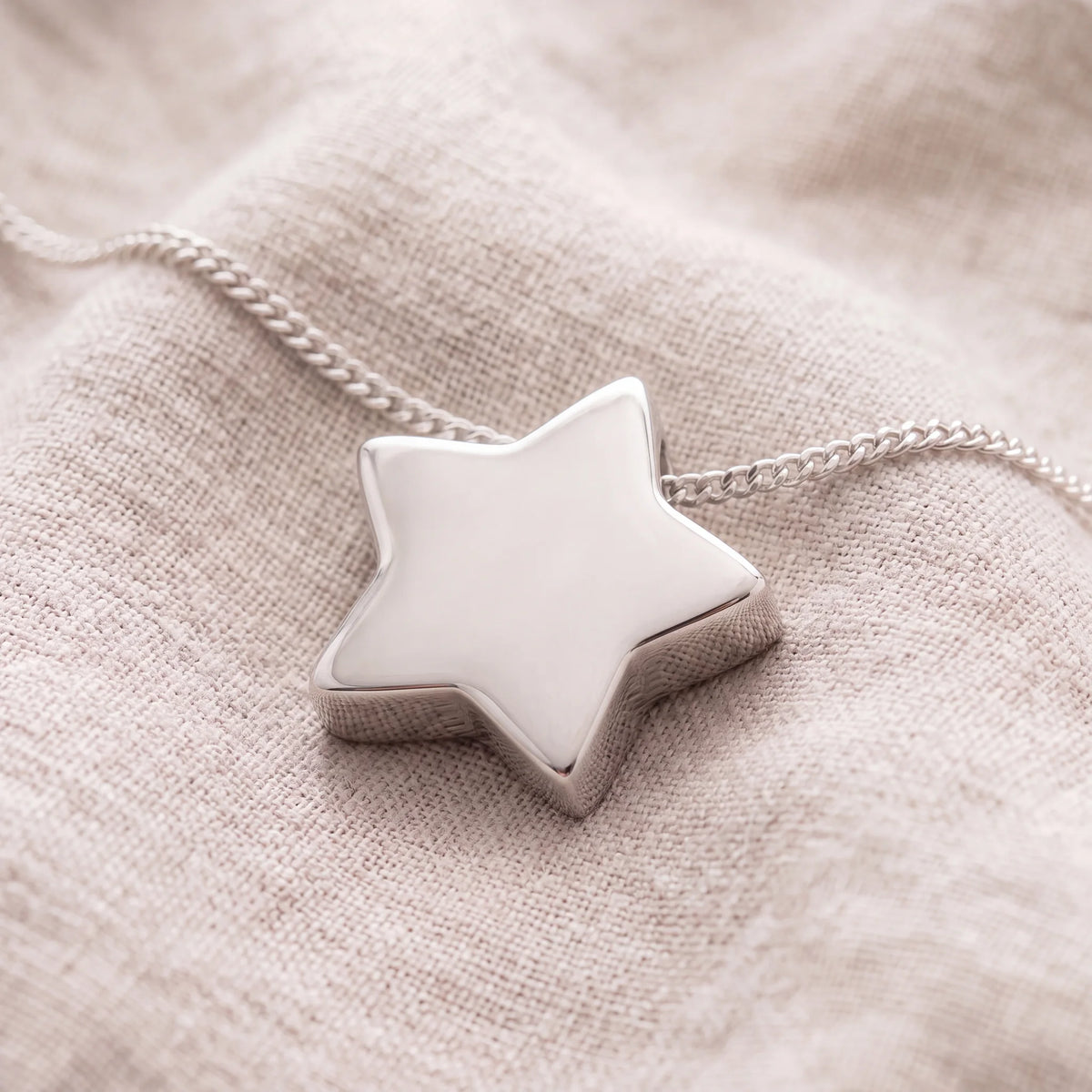 Self-fill-Star-Memorial-Ashes-Pendant-On-Linen
