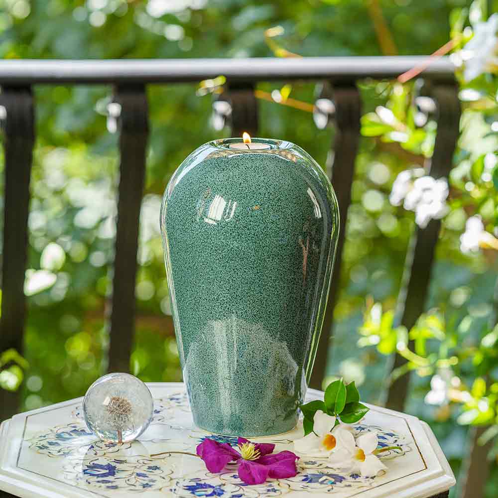 Serenity Adult Cremation Urn for Ashes in Oily Blue Melange Outside on Table