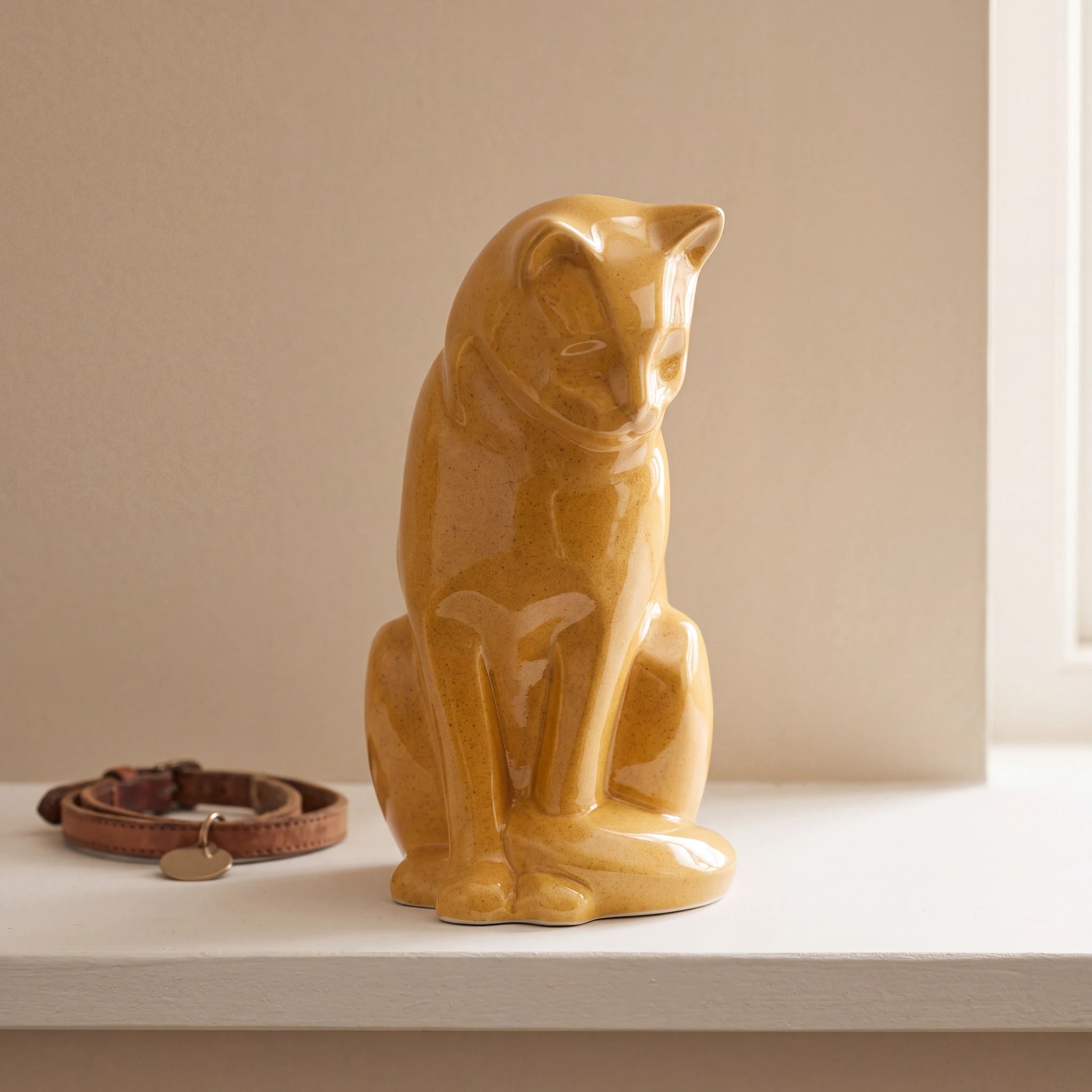 Sitting-Cat-Urn-for-Ashes-in-Amber-pet_collar_ledge
