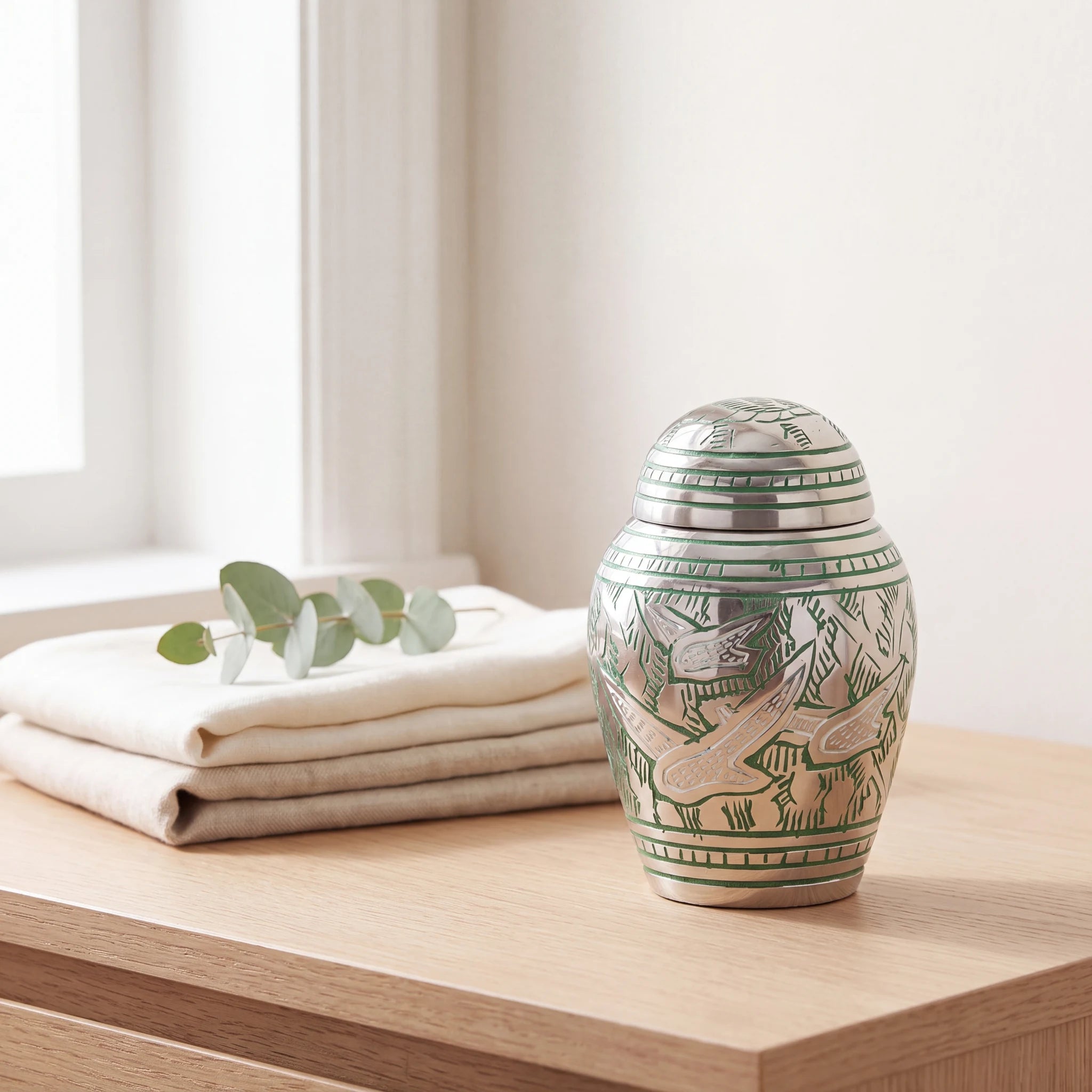 Soaring-Doves-Metal-Keepsake-Urn-for-Ashes-in-Green-and-Silver-Folded-Linen