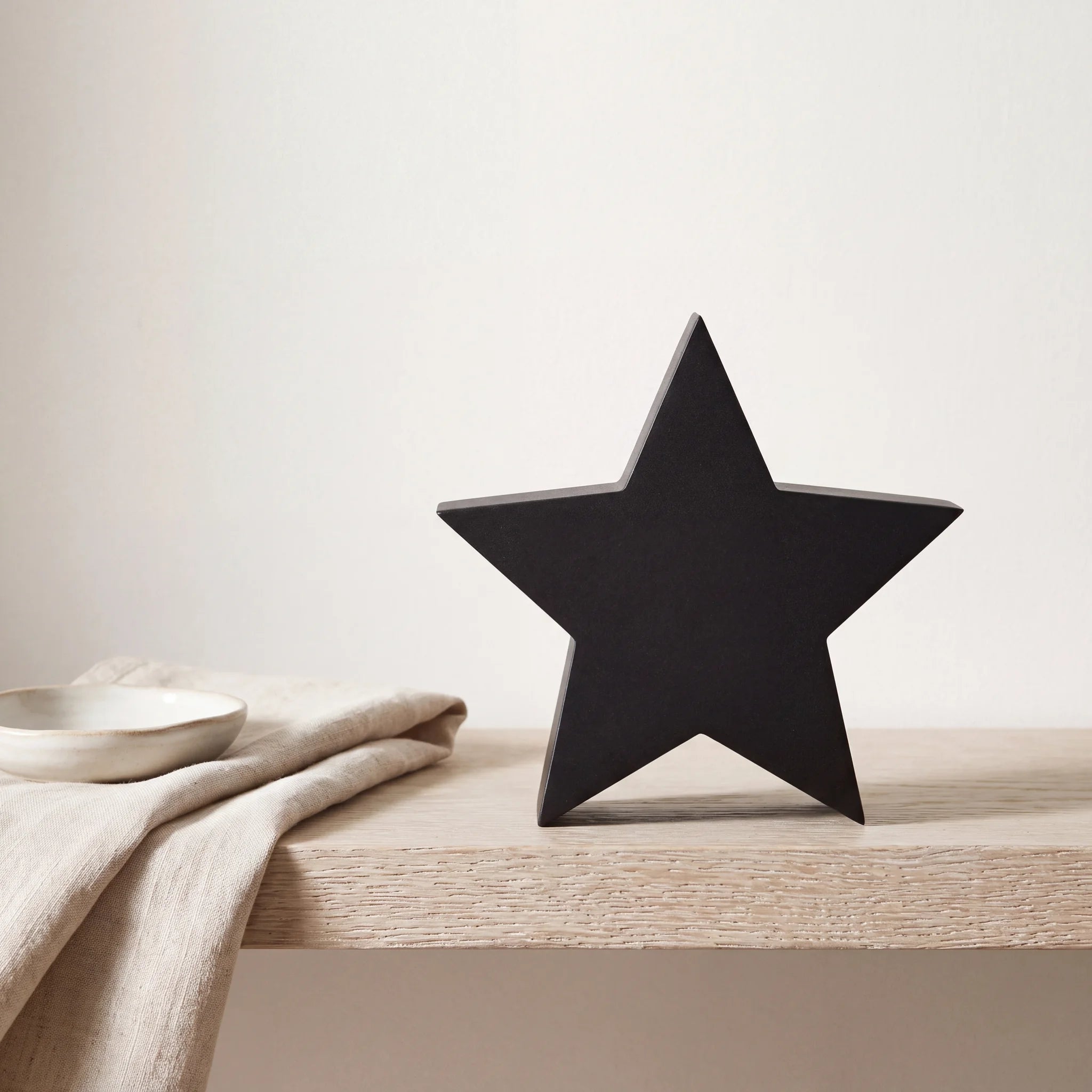 Star-Extra-Small-Urn-for-Ashes-in-Matte-Black-Stainless-Steel-keepsake_folded_napkin