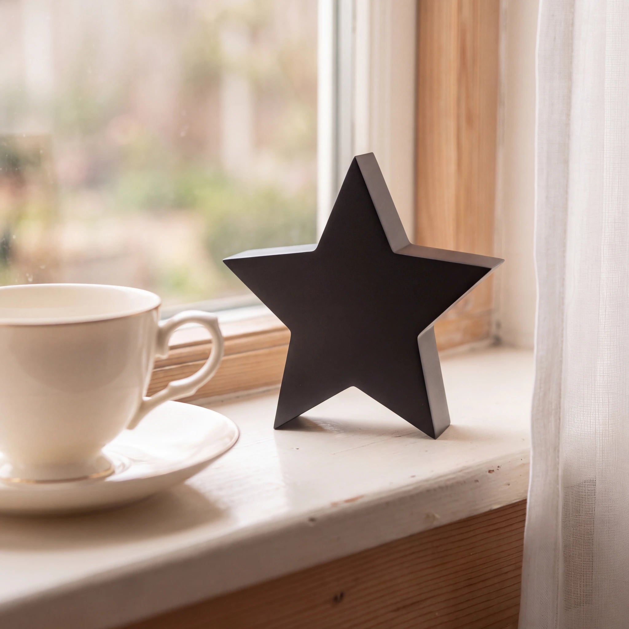 Star-Extra-Small-Urn-for-Ashes-in-Matte-Black-Stainless-Steel-keepsake_teacup_sill