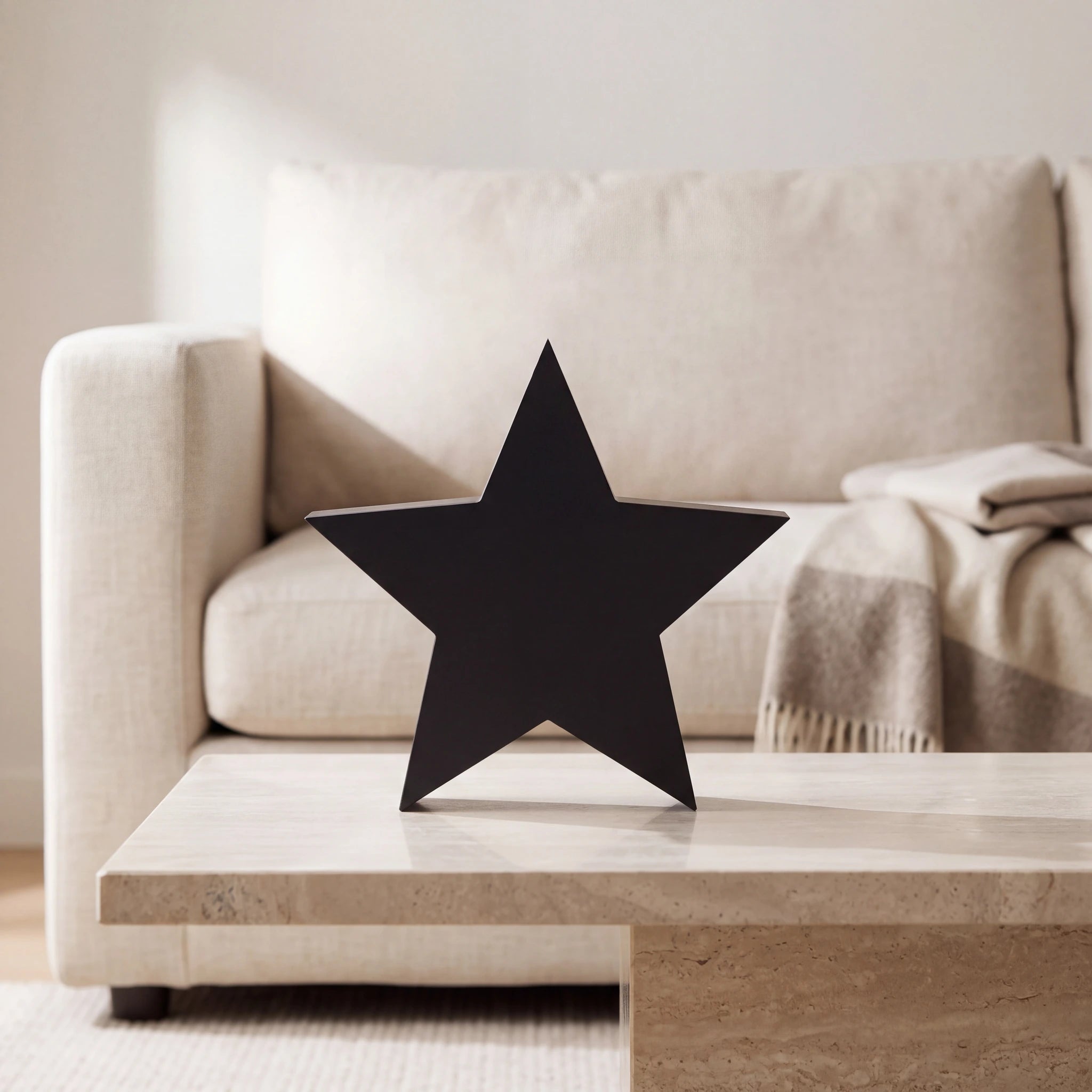 Star-Medium-Urn-for-Ashes-in-Matte-Black-Stainless-Steel-amto_stone_coffee