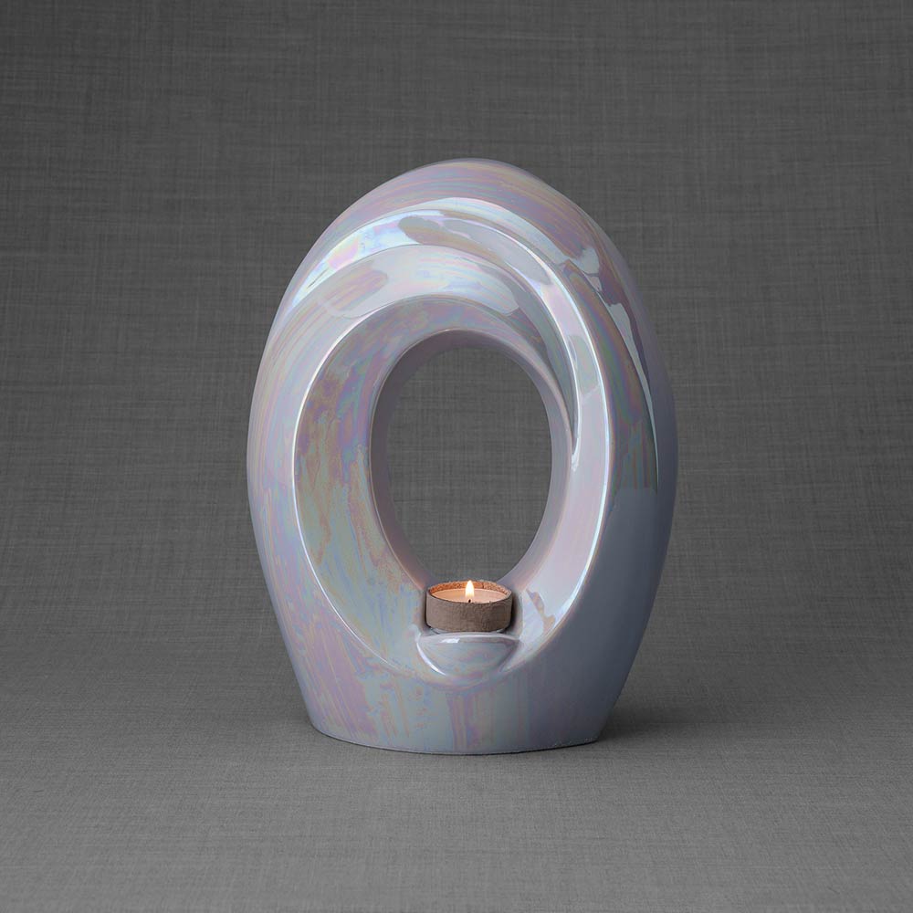 The Passage Adult Cremation Urn for Ashes in Pearlescent White Back Dark Background