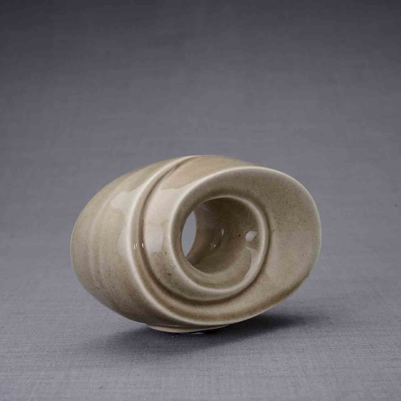 The Passage Ashes Keepsake Urn in Beige Grey Front Facing Right Dark Background