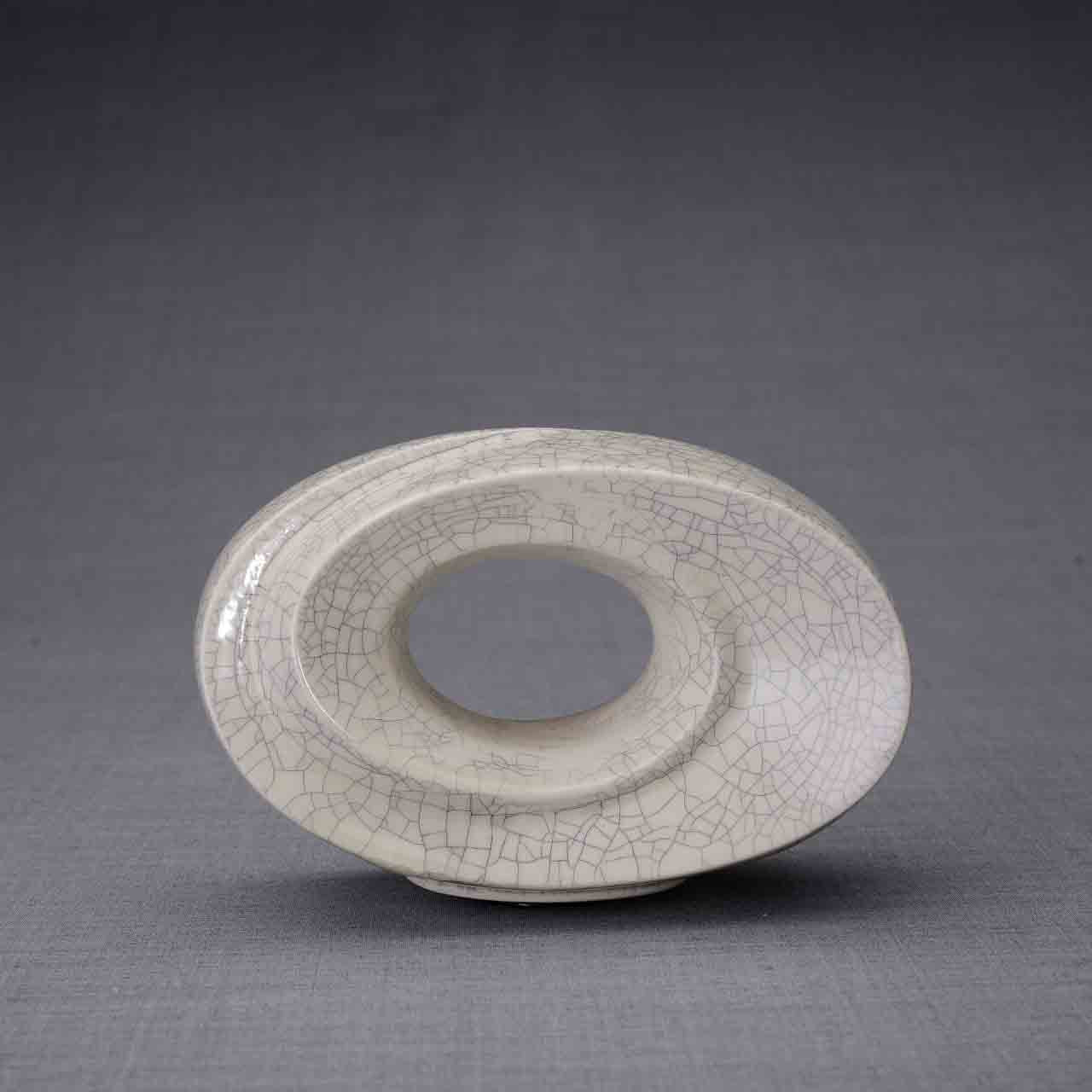 The Passage Ashes Keepsake Urn in Crackle Glaze Front Facing on Left Dark Background