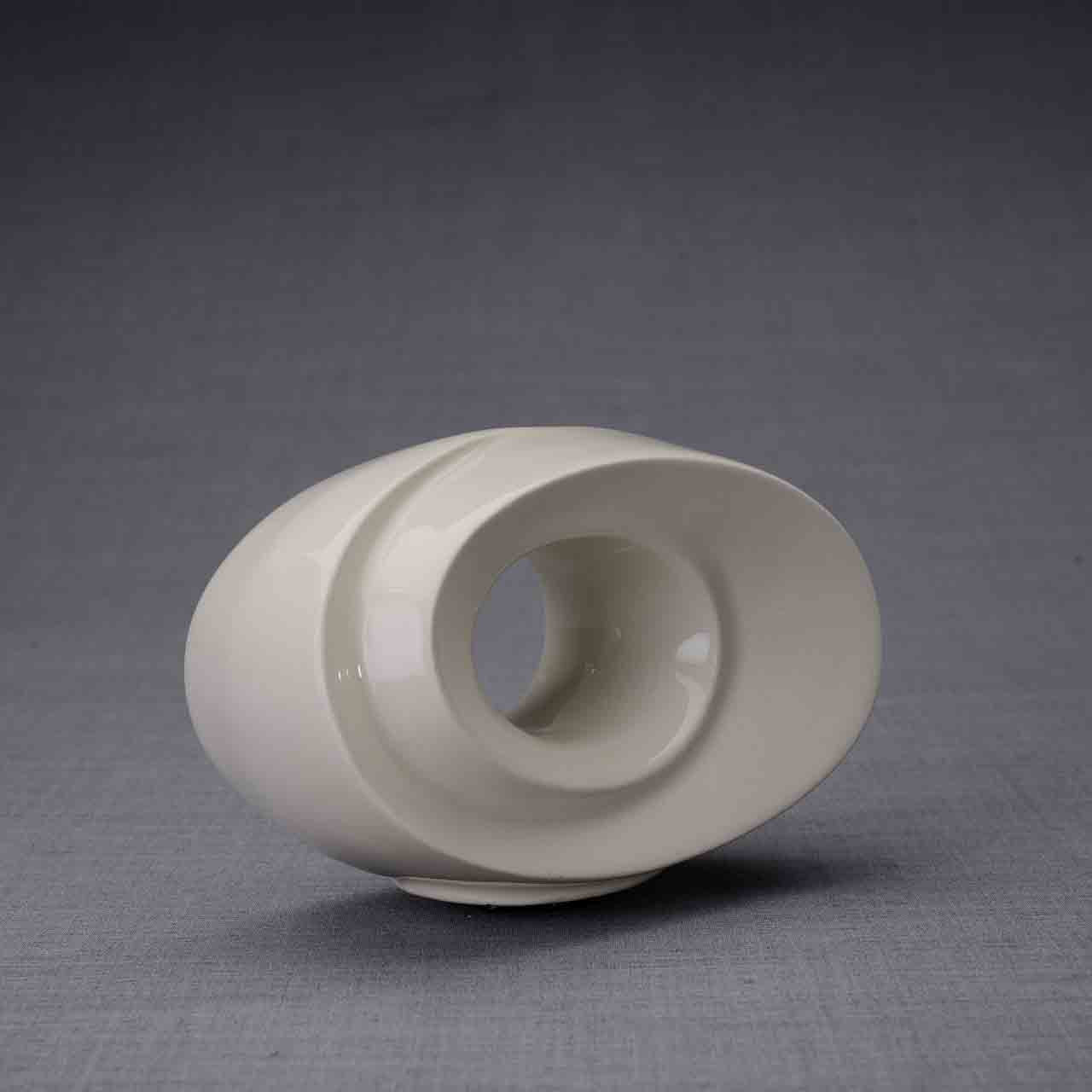 The Passage Ashes Keepsake Urn in Cream Turned Right Dark Background