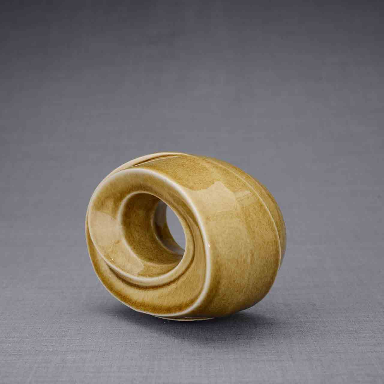The Passage Ashes Keepsake Urn in Dark Sand Turned Left Dark Background