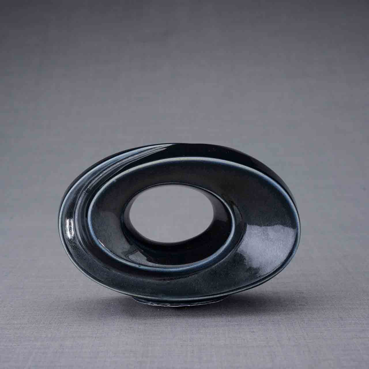 The Passage Ashes Keepsake Urn in Midnight Blue Front Facing Dark Background