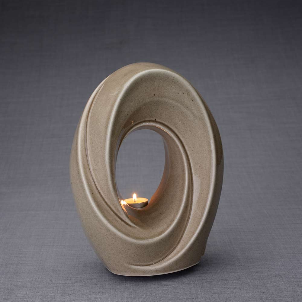The Passage Cremation Urn for Ashes in Beige Grey Facing Right Dark Background