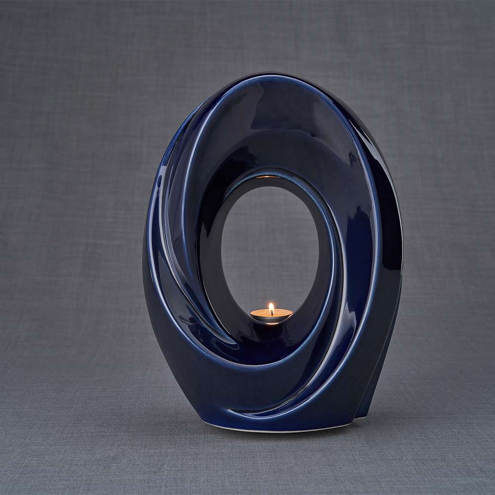 The Passage Cremation Urn for Ashes in Metallic Blue Dark Background