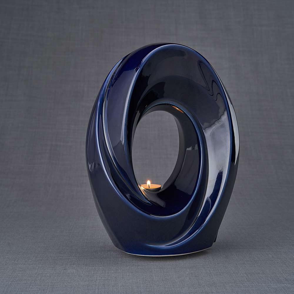The Passage Cremation Urn for Ashes in Metallic Blue Turned Right Dark Background
