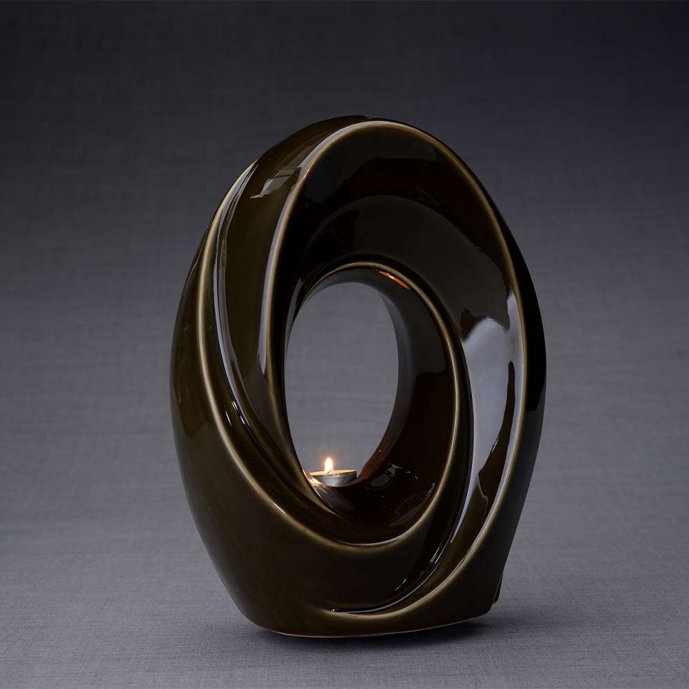 The Passage Cremation Urn for Ashes in Oily Brown Turned Right Dark Background
