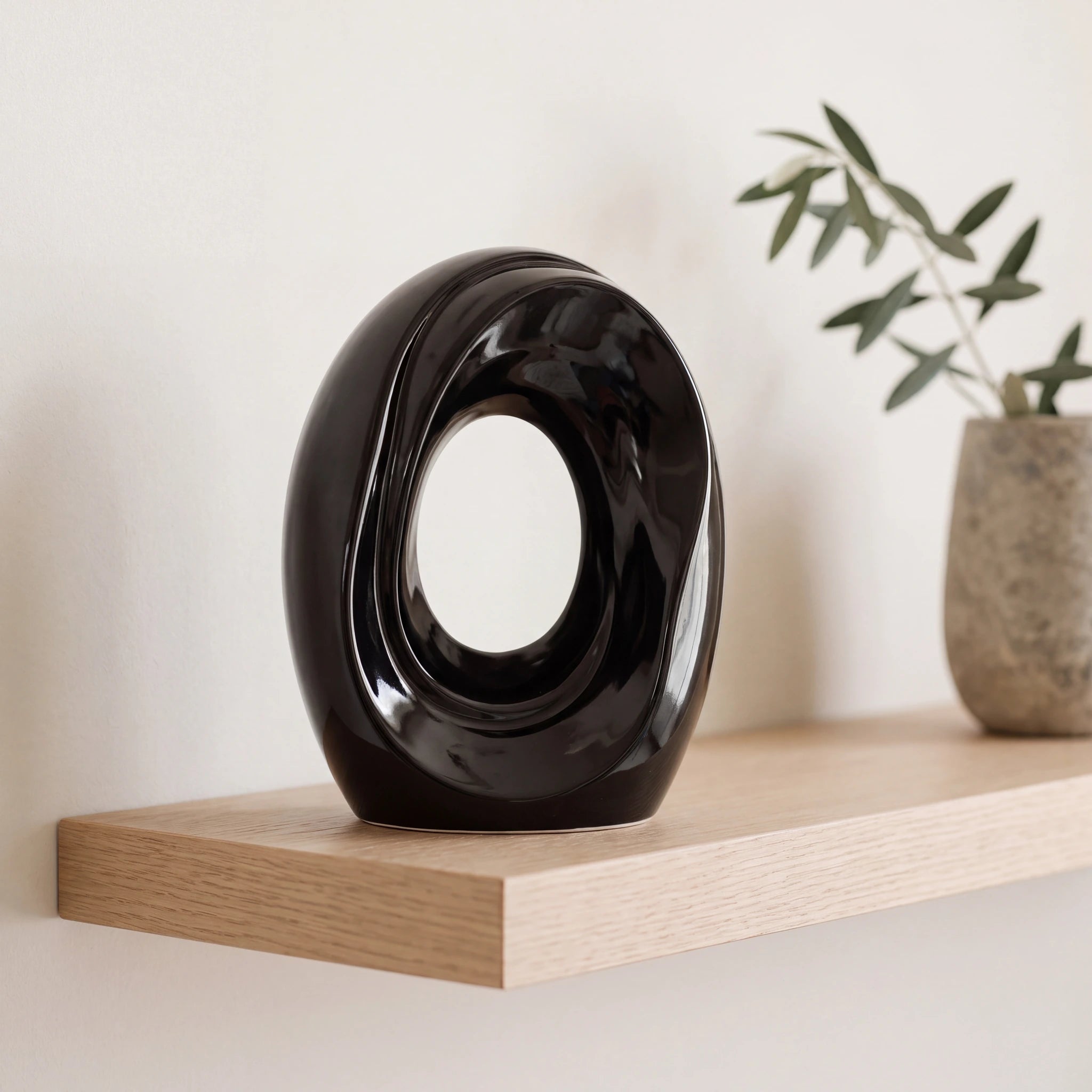 The-Passage-Medium-Urn-for-Ashes-in-Glossy-Black-Oak-Shelf