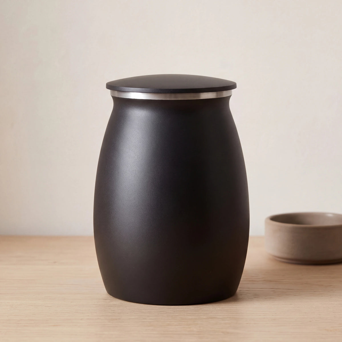Tribute-Metal-Medium-Urn-for-Ashes-in-Matte-Black-pet_bowl_ledge