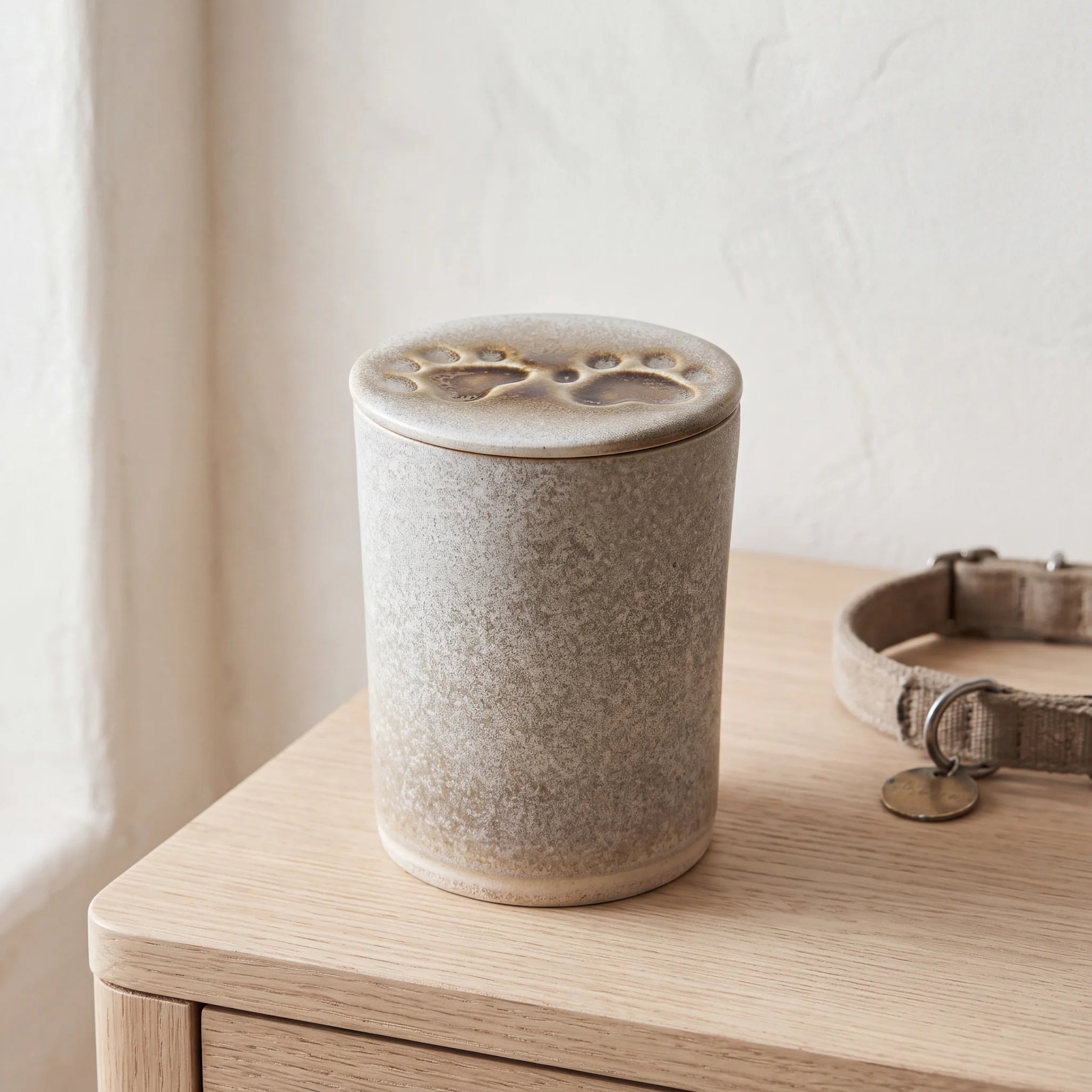 Two-Paws-Pet-Urn-for-Ashes-in-Sandy-White-Top-View