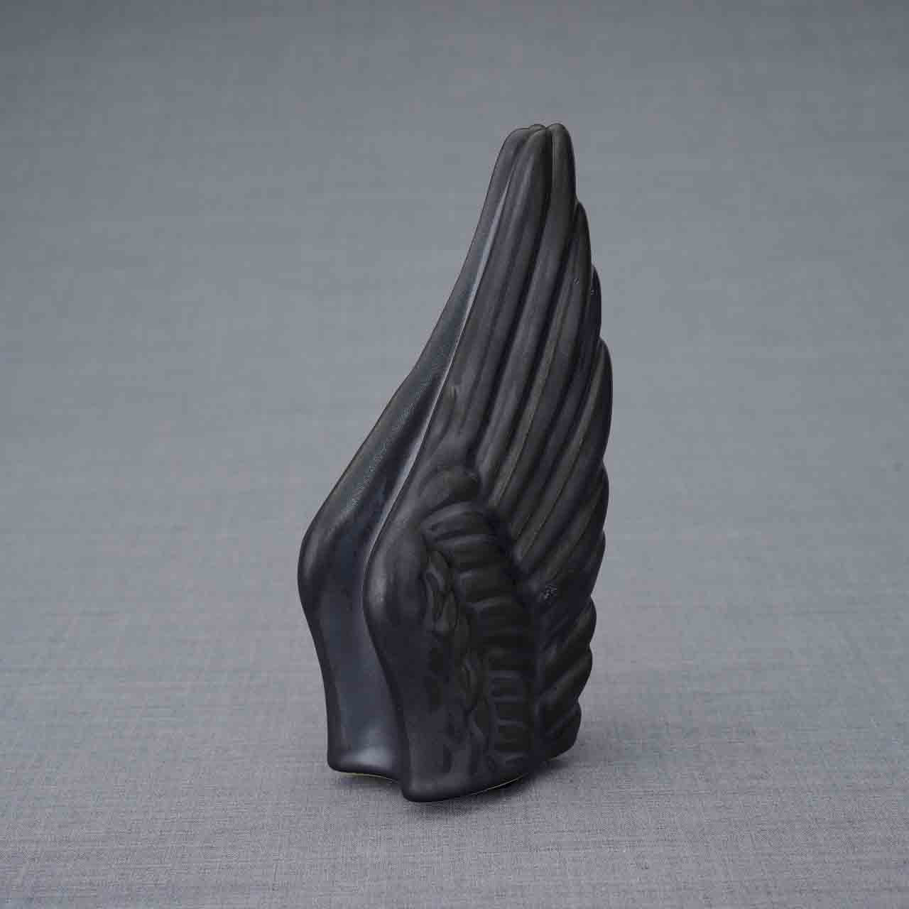 Wings Ashes Keepsake Urn in Matte Black Turned Right Dark Background